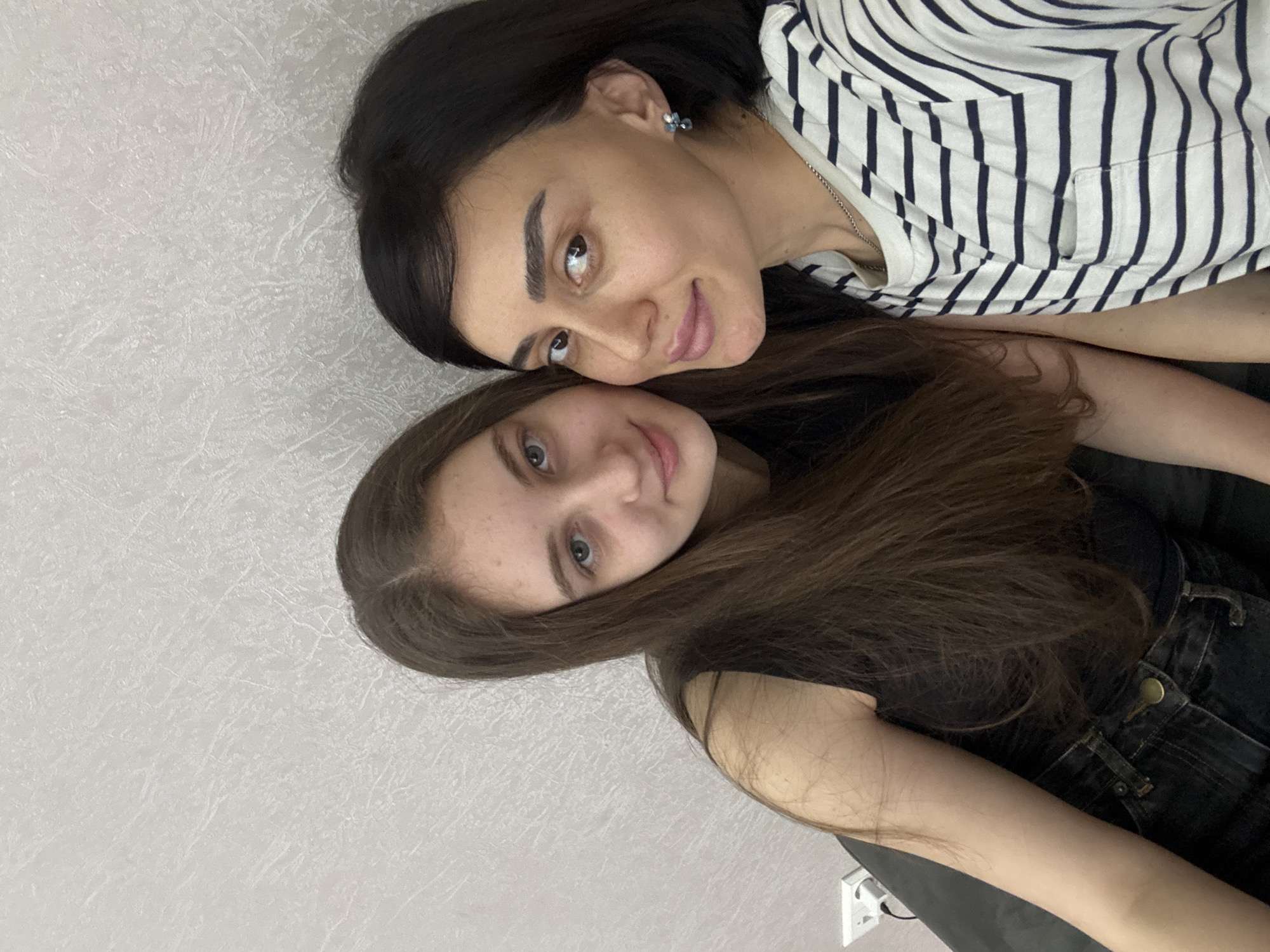 Two women share casual moments at Tbilisi residence