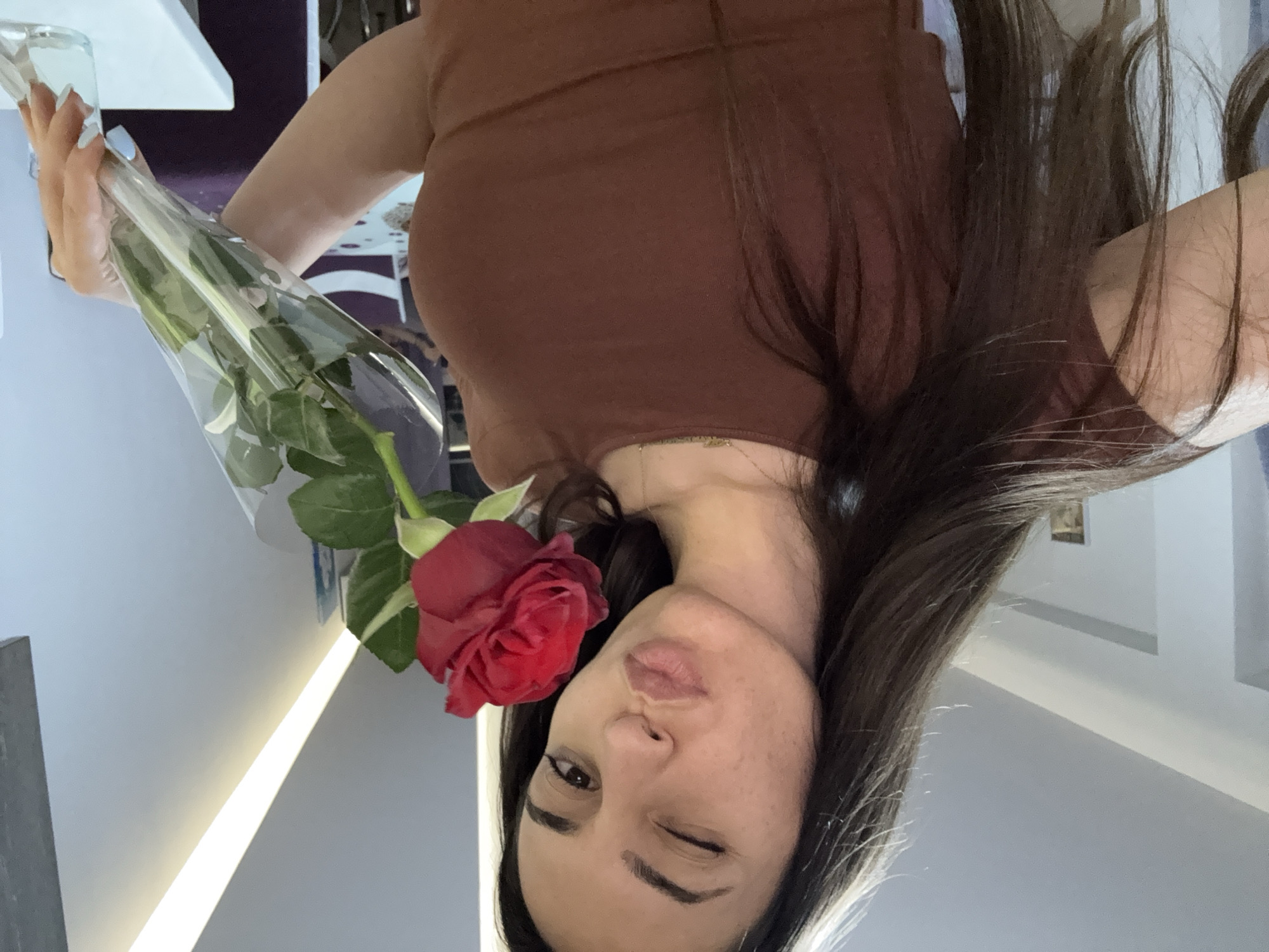 Woman takes selfies in Plovdiv wearing "Out of Office" cap