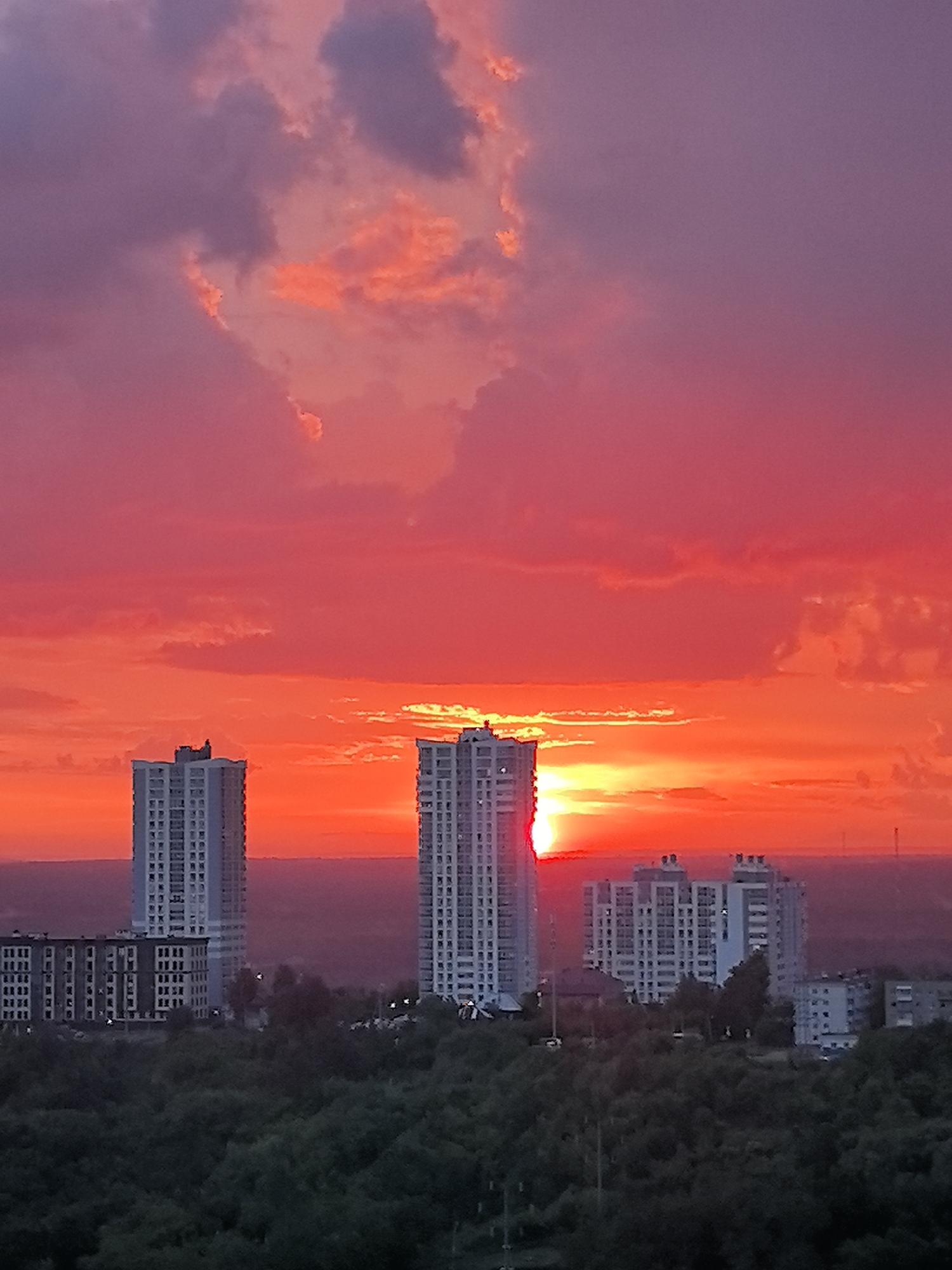 Vibrant sunset colors dramatic Perm skyline in evening light