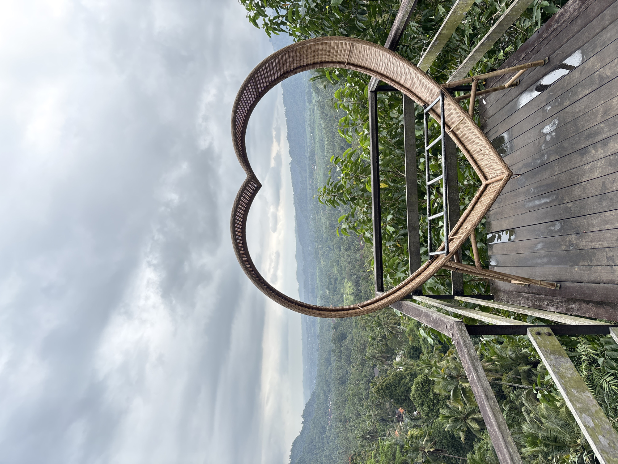 Heart-shaped rattan frame overlooks Sidemen's green valley