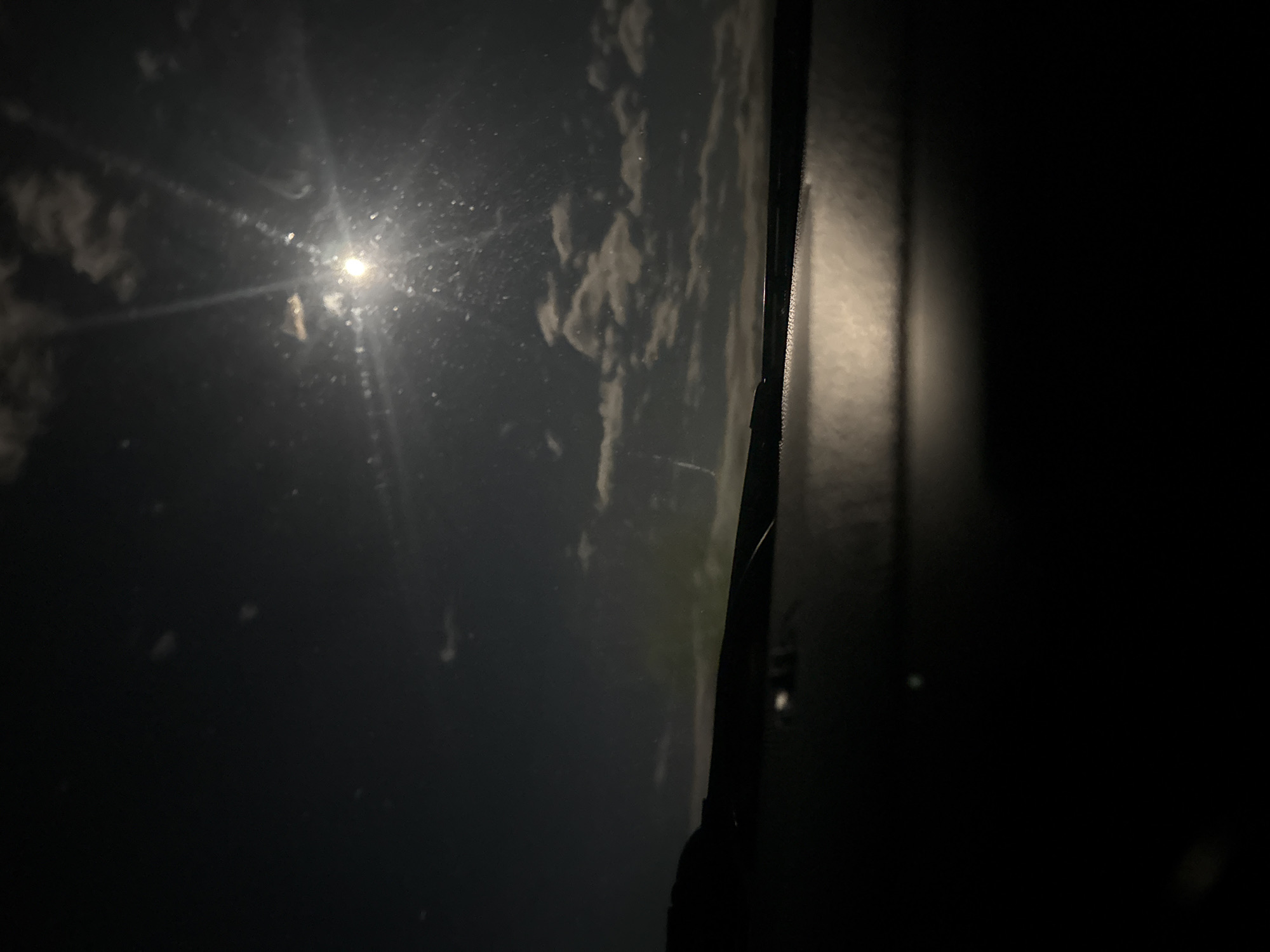 Nighttime view captured from vehicle window in Karlovo, Bulgaria