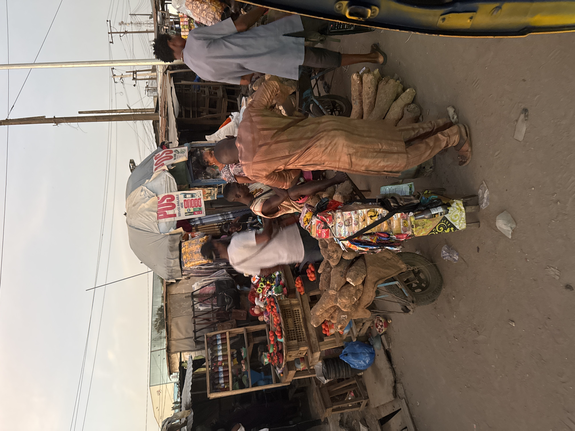 Street vendors conduct evening business in Agbara, Nigeria