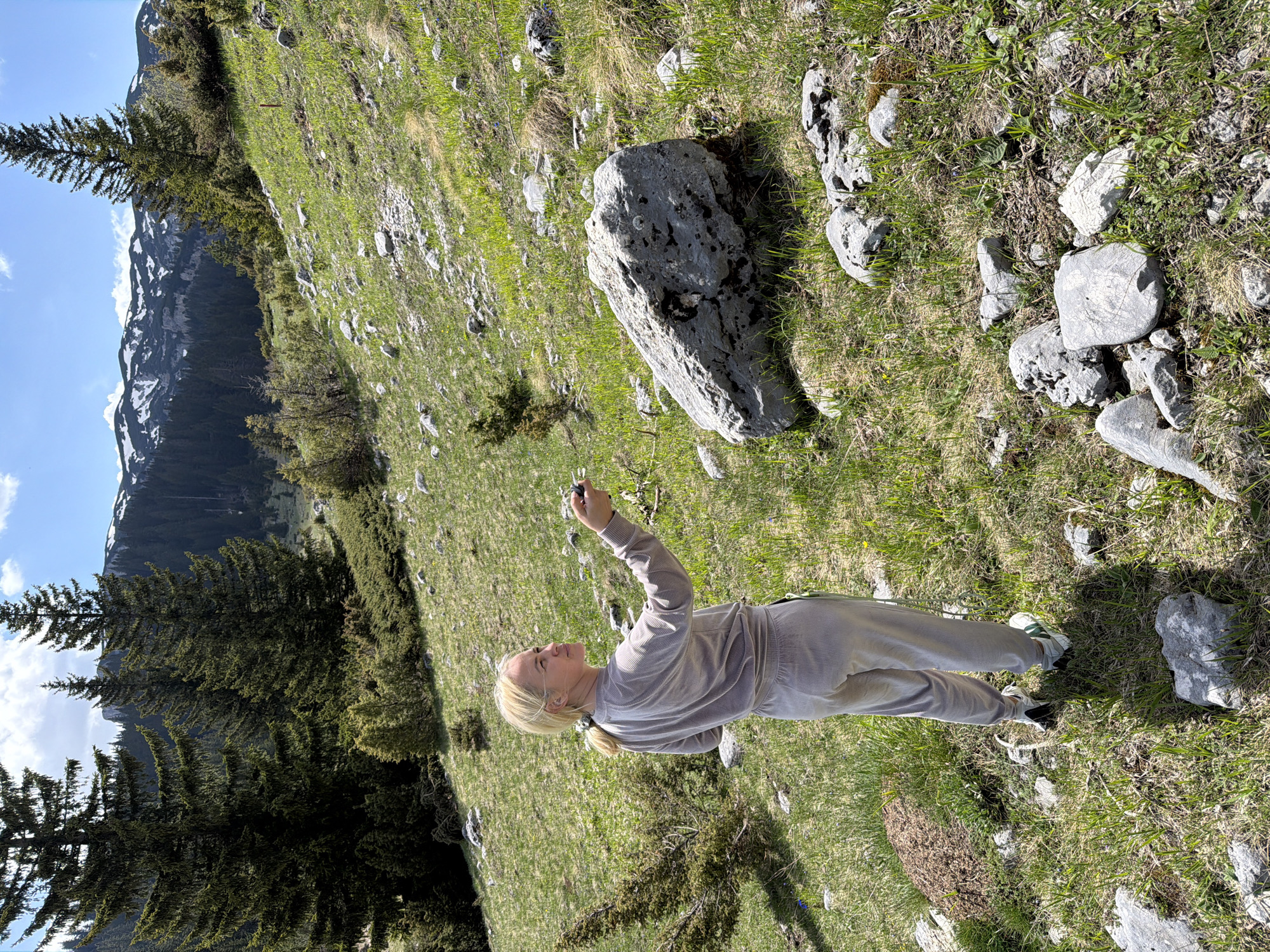 Woman photographed jumping on Montenegro hillsides near mountain roads