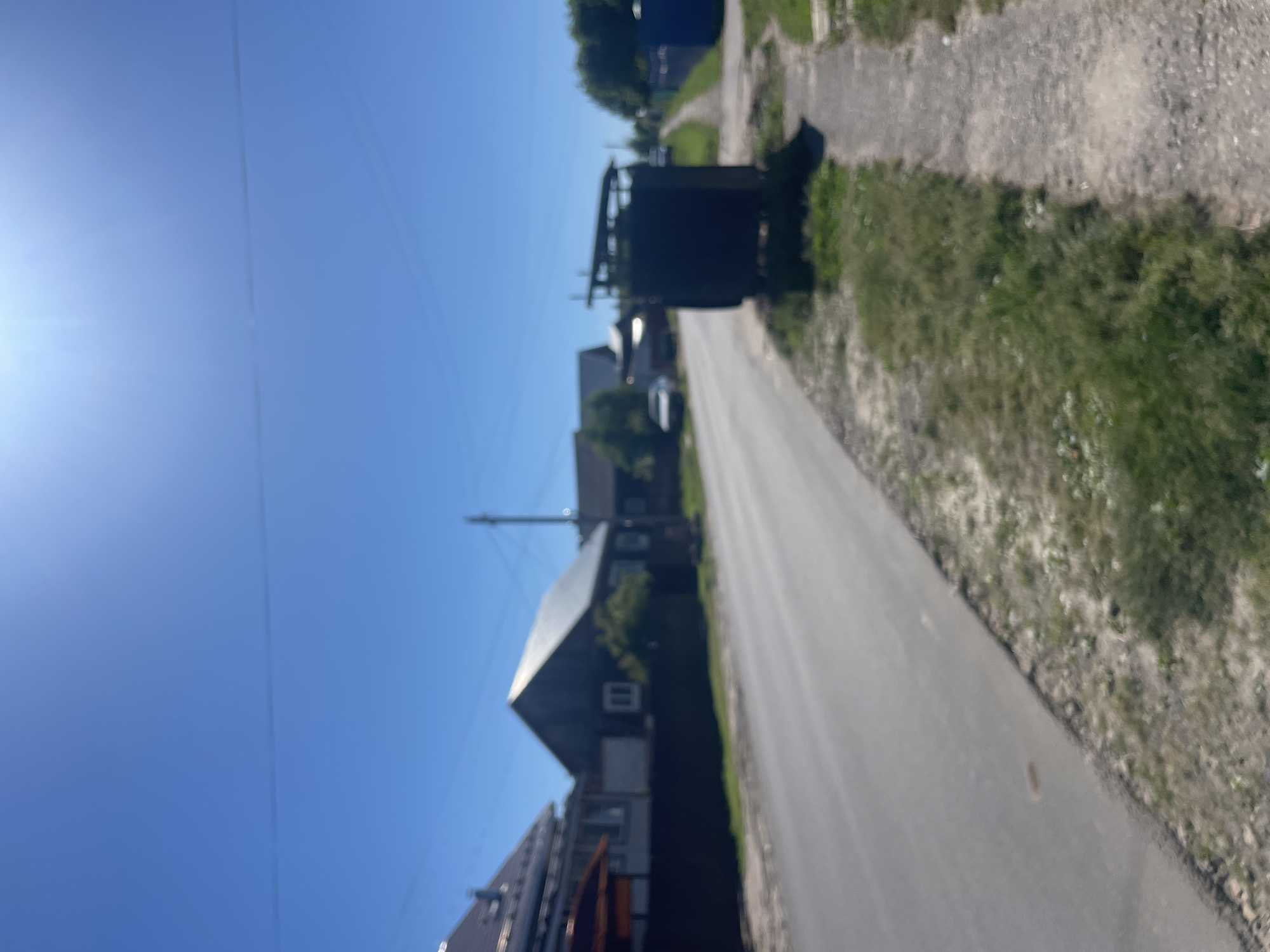Rural Russian village street scenes documented in sunny afternoon