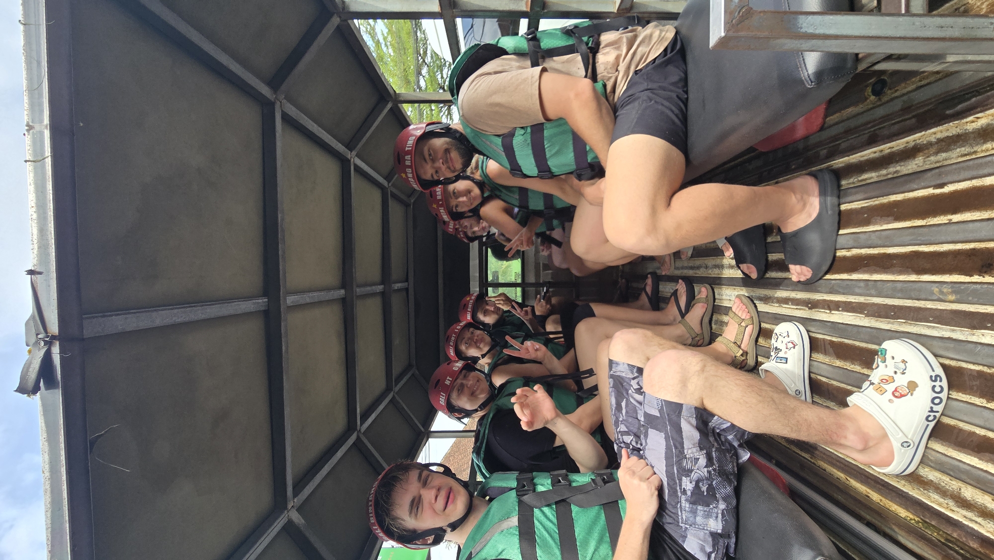Group in safety gear rides open truck through Ubud streets