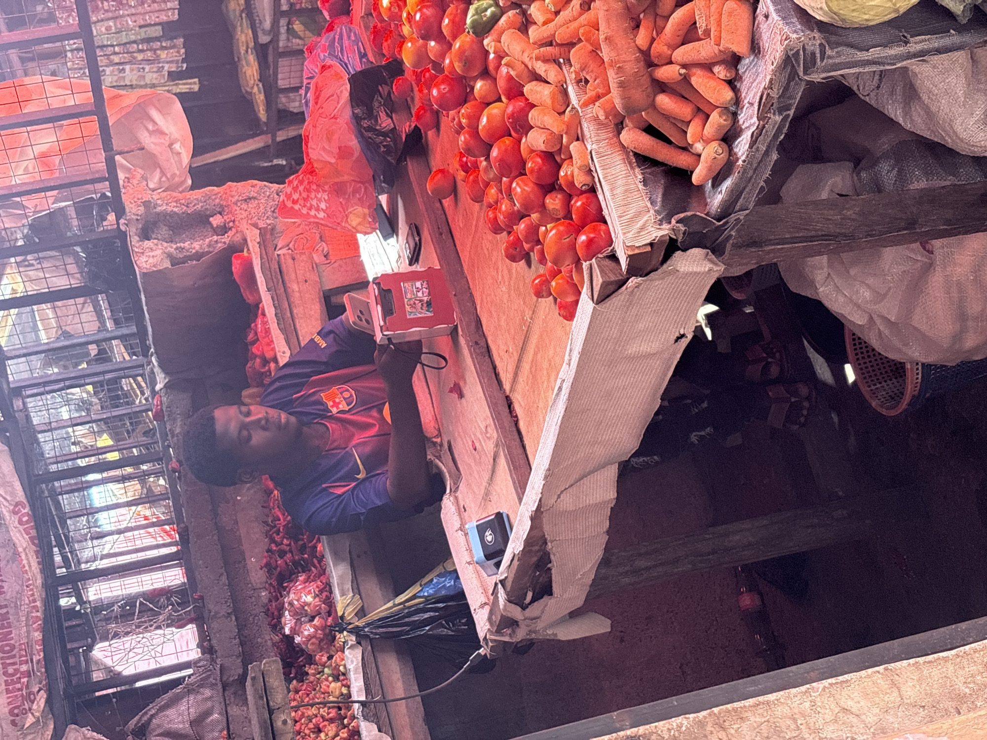 Nigerian market vendors conduct morning business in Iddo Tudunwada