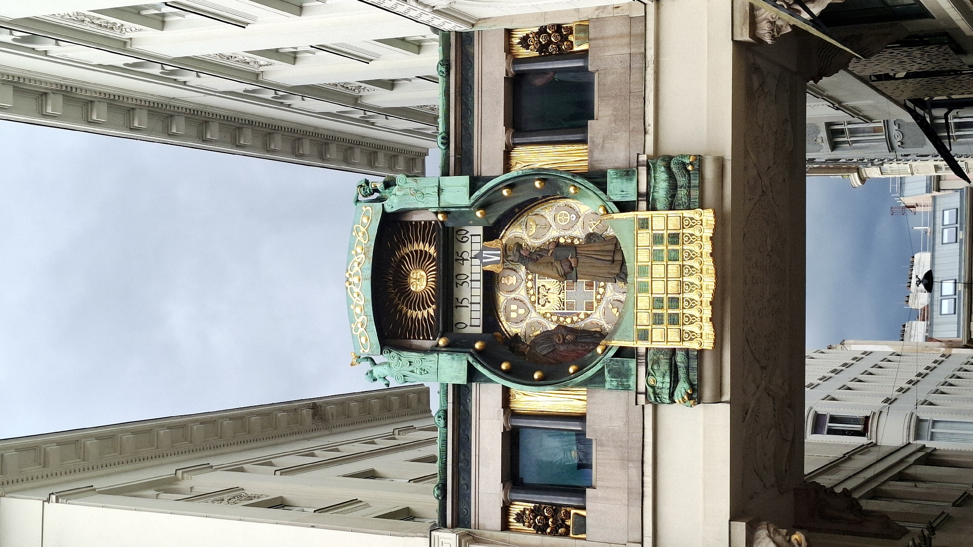 Vienna tourist scenes documented: historic clock, restaurants, horse carriage
