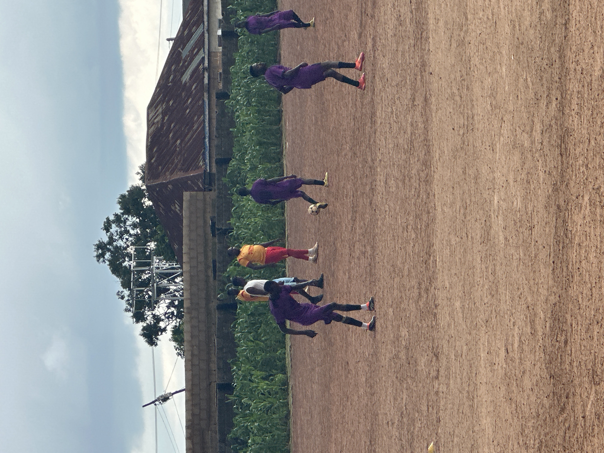 Soccer match plays out under stormy skies in rural Nigeria
