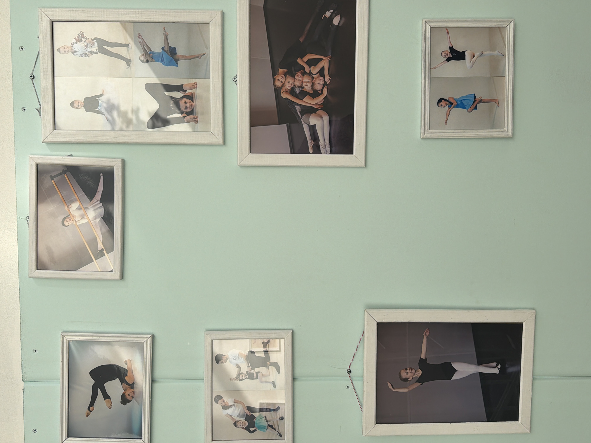 Ballet photo collection displayed on wall in Saint Petersburg
