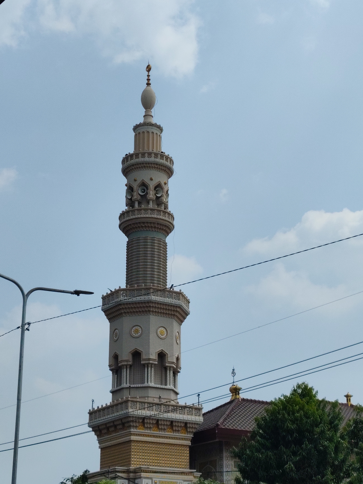 Ornate mosque minaret stands tall in Dolopo, East Java