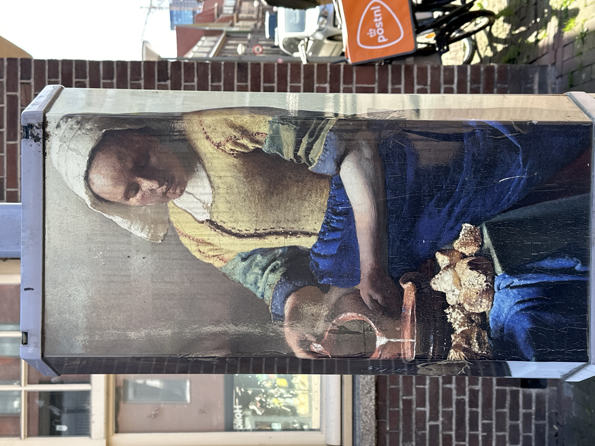 Amsterdam street scenes captured: Vermeer art, contrails, urban details