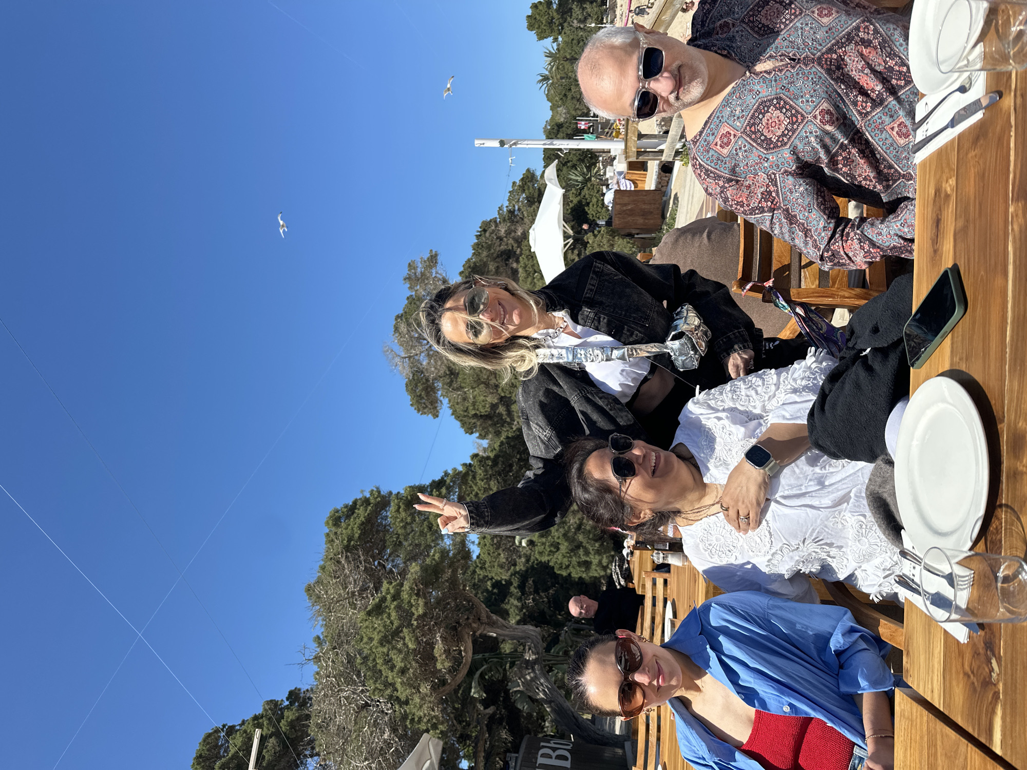 Spring day unfolds in Sant Josep: dining, beach crowds, taxi