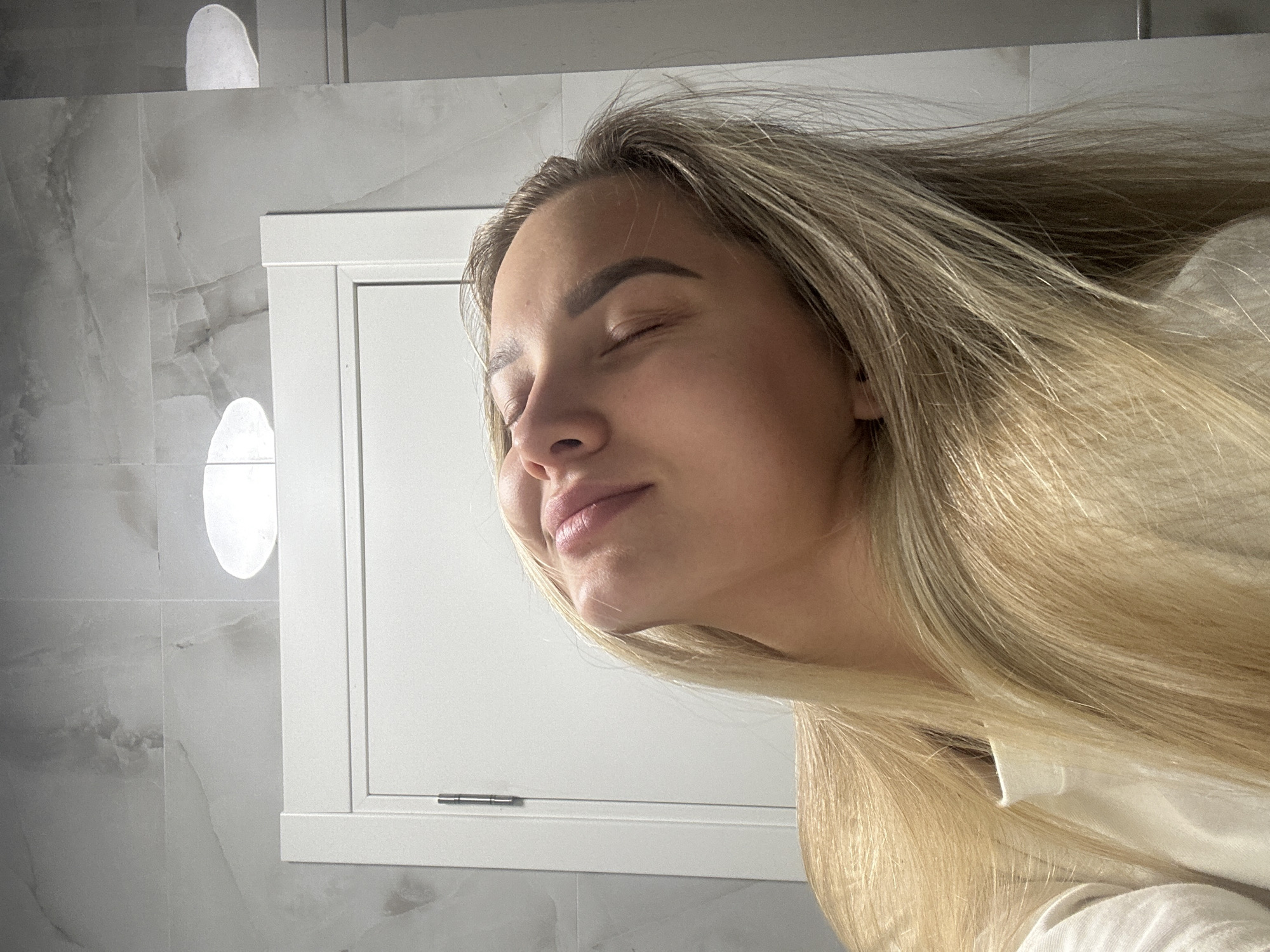 Woman takes morning selfies while getting ready in Budva