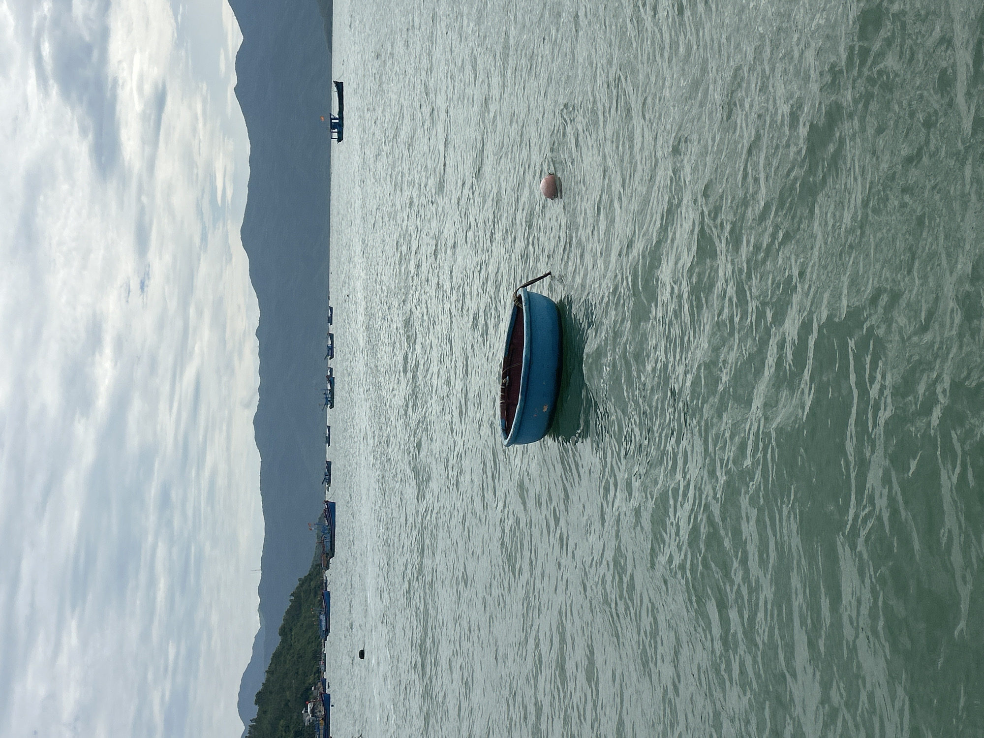 Fishing boats, speedboat, and ferry off the Vietnam coast