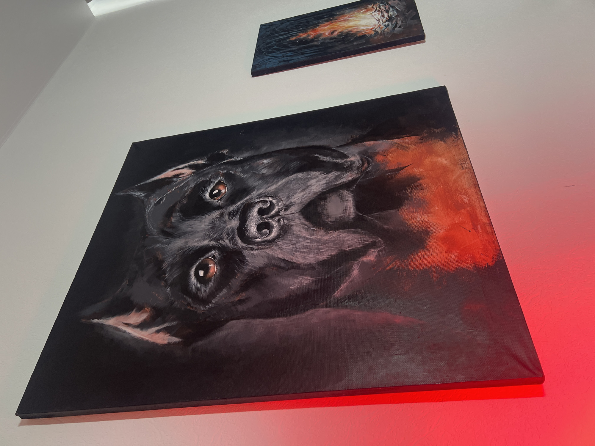 Woman views animal and floral paintings at Tyumen gallery