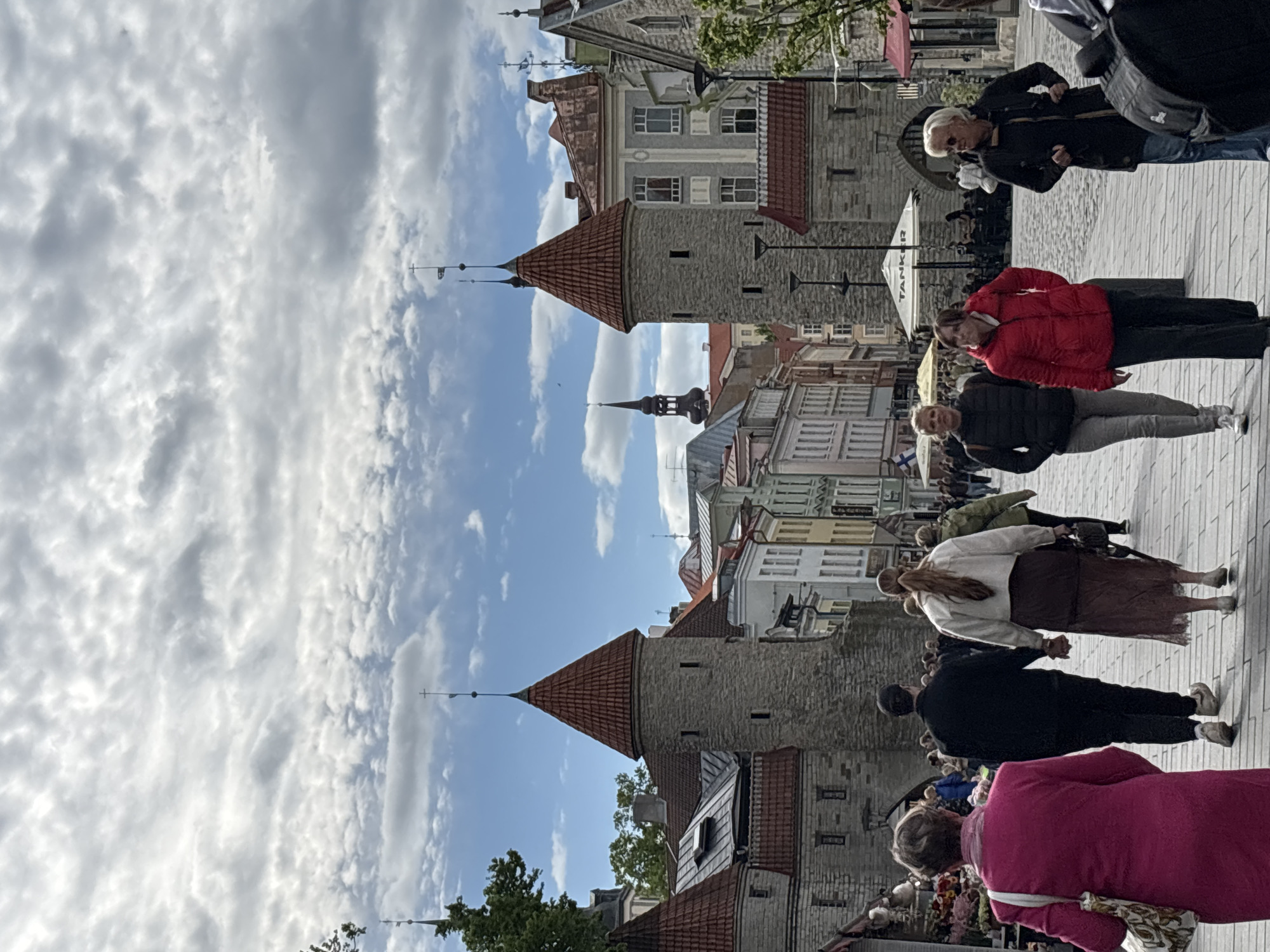 Casual tourism moments captured across Tallinn's historic districts