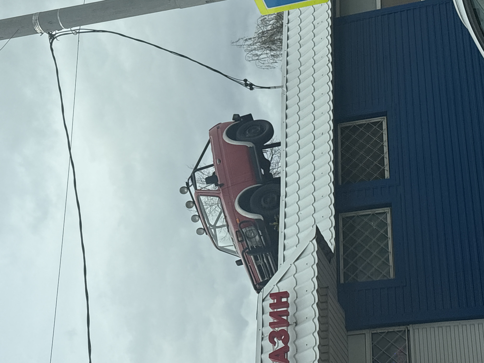 Red Vehicle With Roll Cage Spotted Atop Building in Kazan