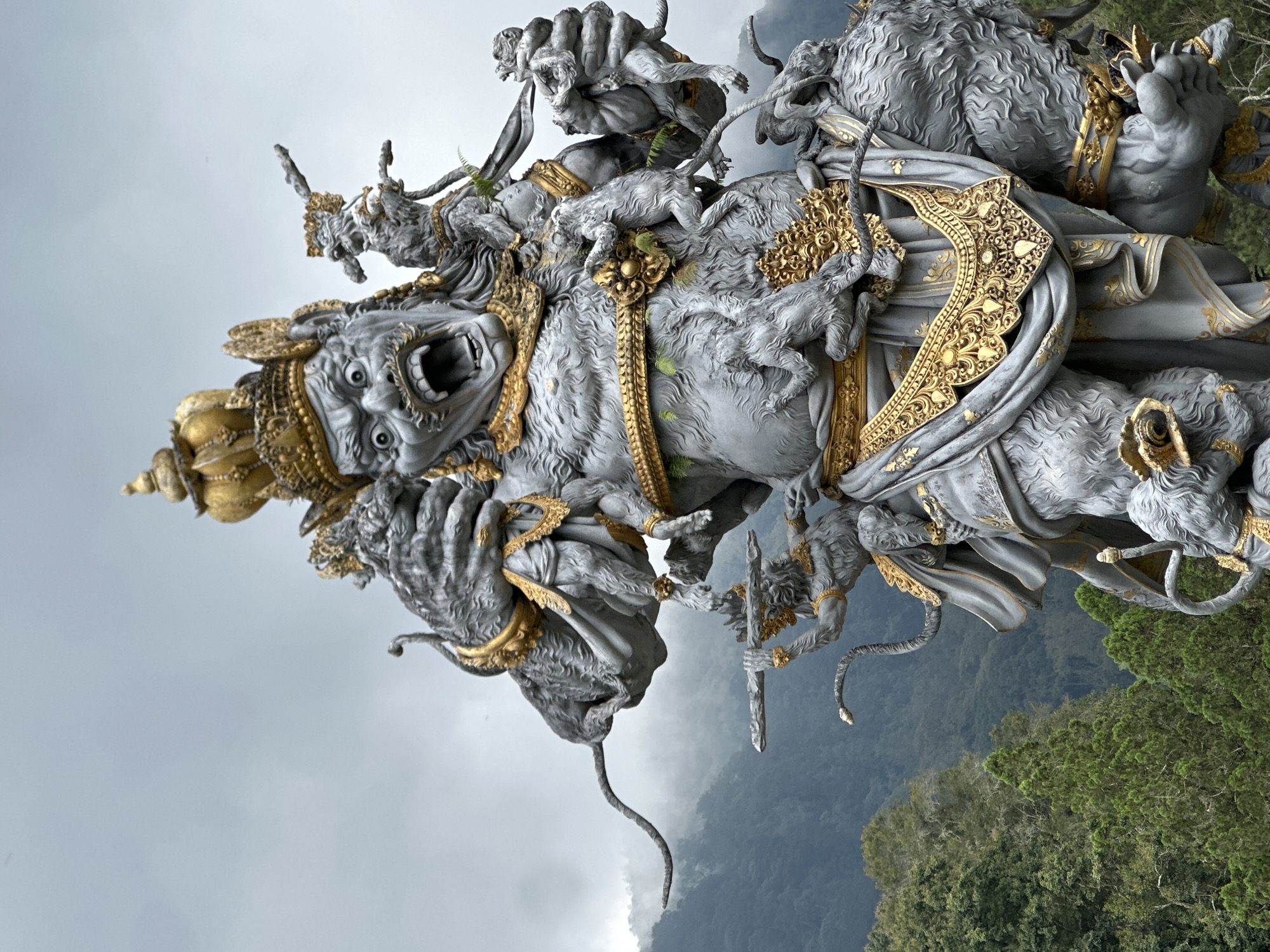 Ornate deity statue with golden accents documented in Baturiti