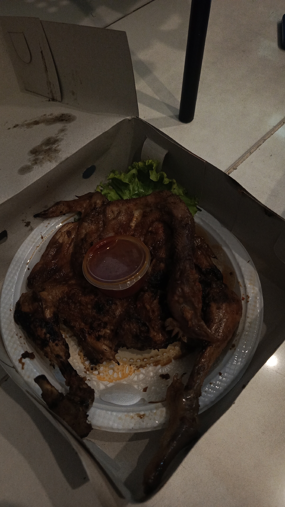 Roasted chicken takeout documented in Surabaya, Indonesia