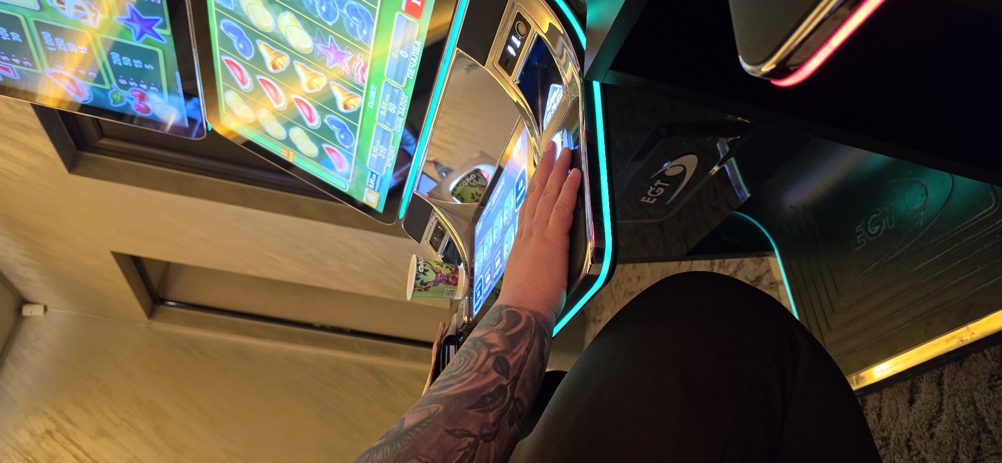 Person plays slot machine in Bulgarian gaming establishment
