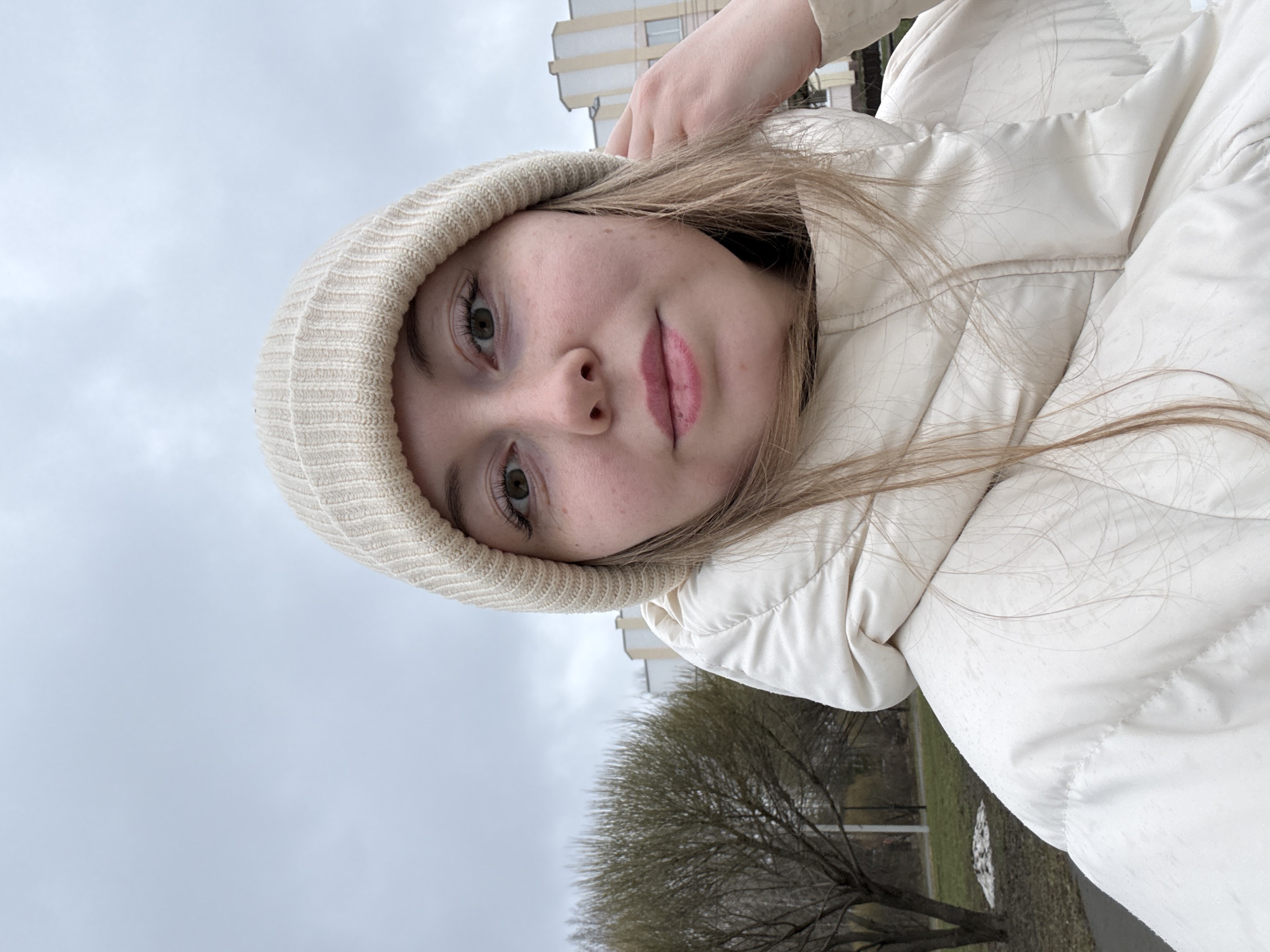 Morning memories: woman's selfies, cat feeding, overcast outdoor scene