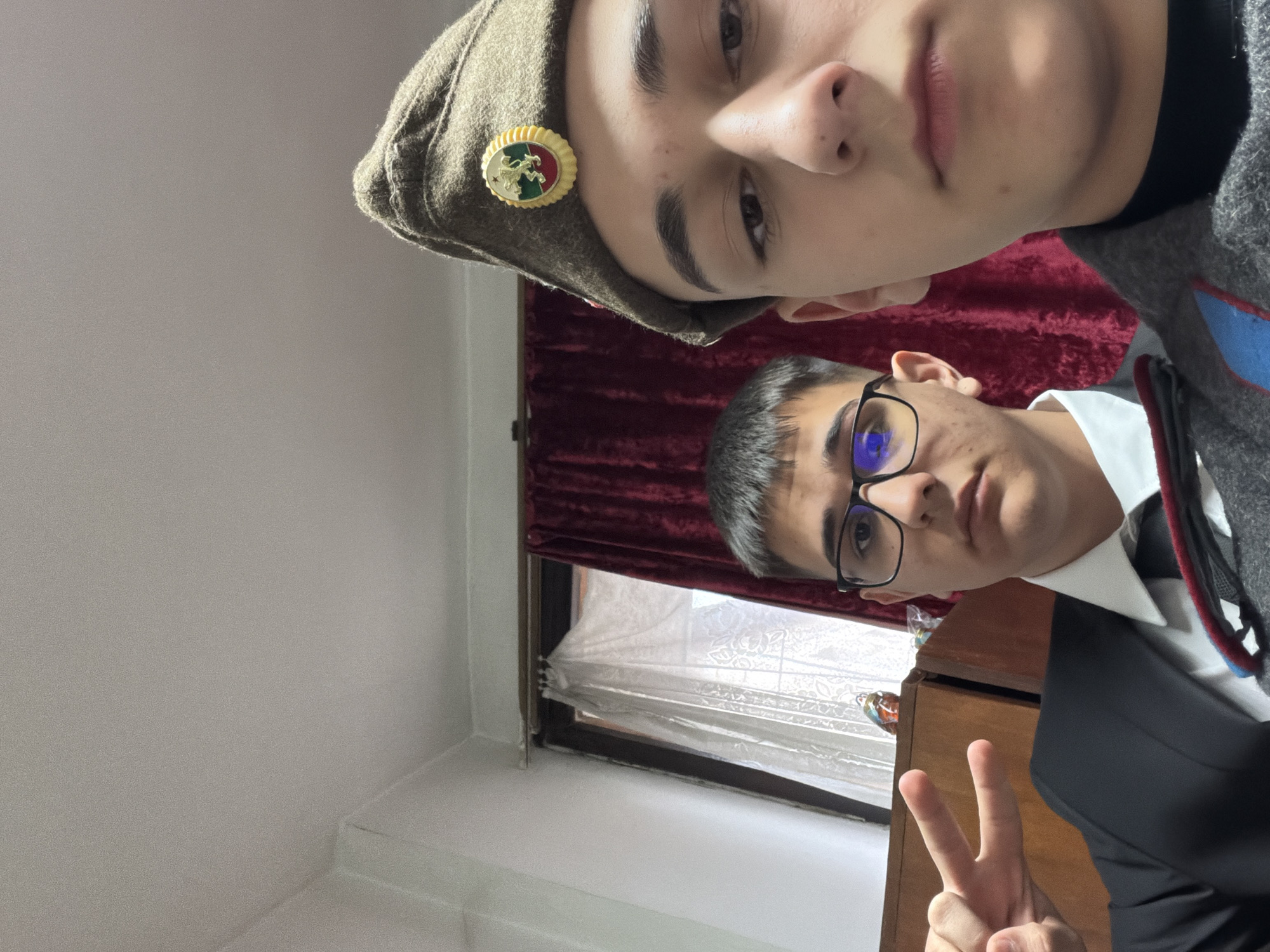 Young men in military uniform, suit pose for selfies