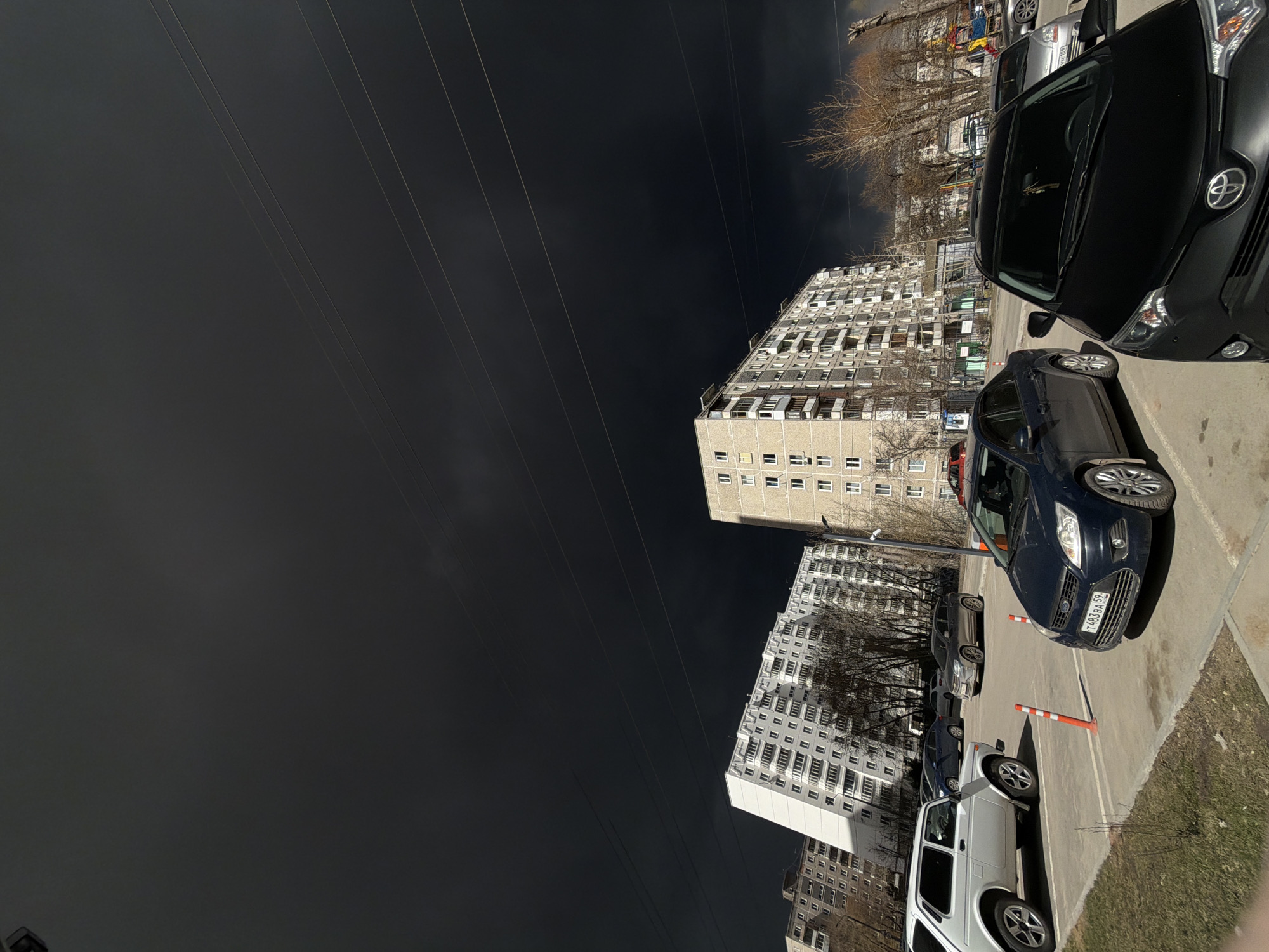 Dark storm clouds gather over Perm residential areas
