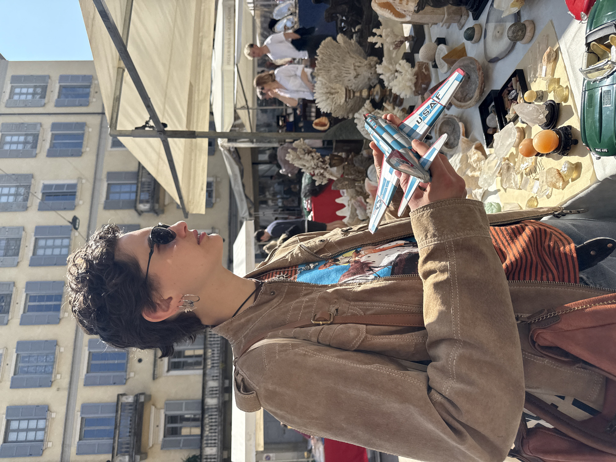 Outdoor market vendors sell toys, games, glassware in Milan