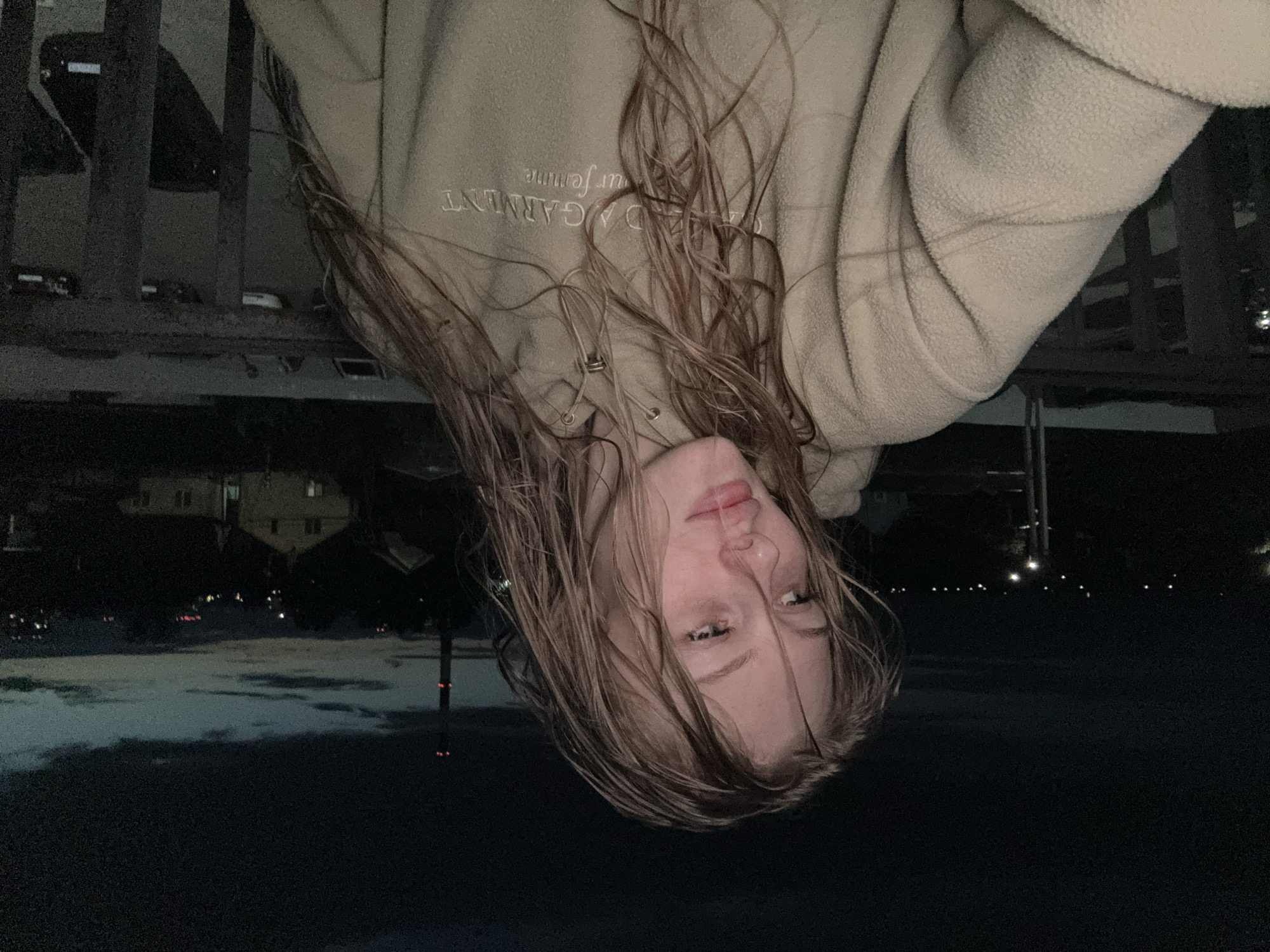 Woman captures dusk selfies on balcony in Kondratovo, Russia