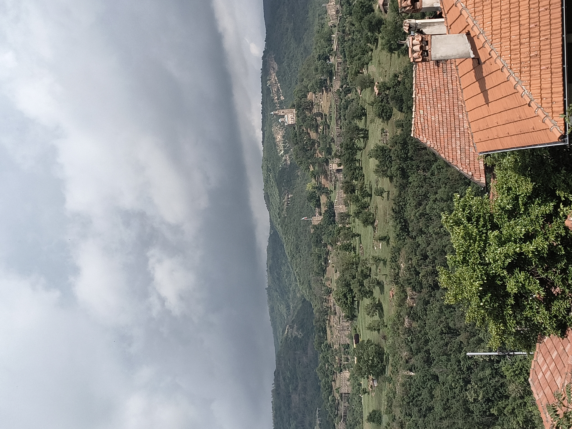 Historic Veliko Tarnovo landscape documented under cloudy Bulgarian skies