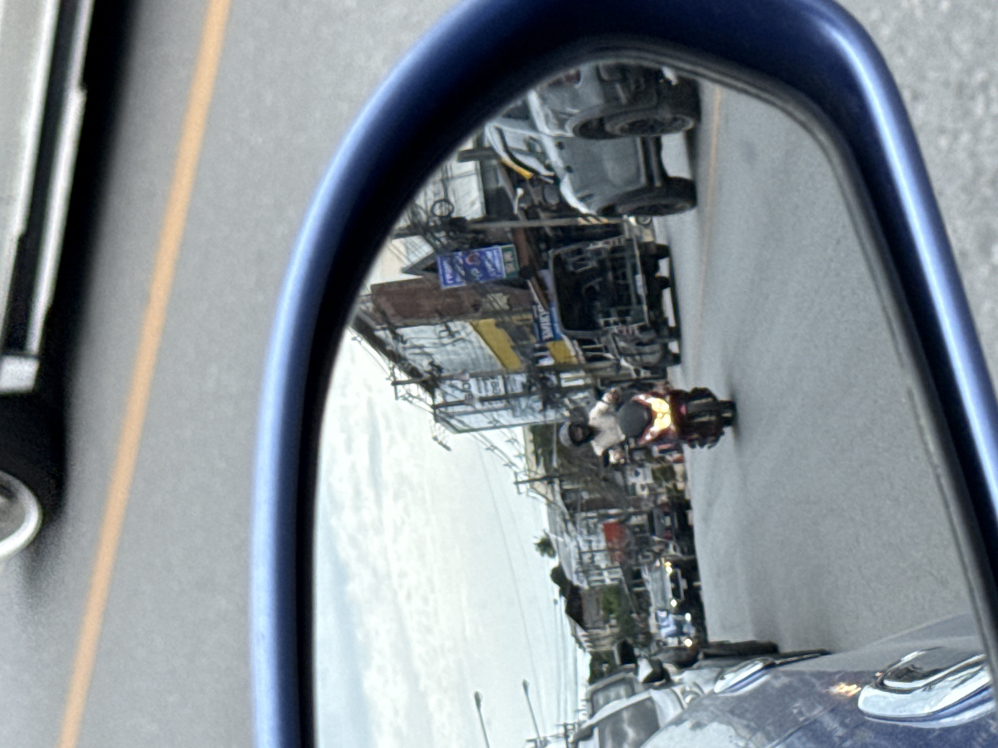 Morning traffic and a Lotus's billboard on Ko Samui streets