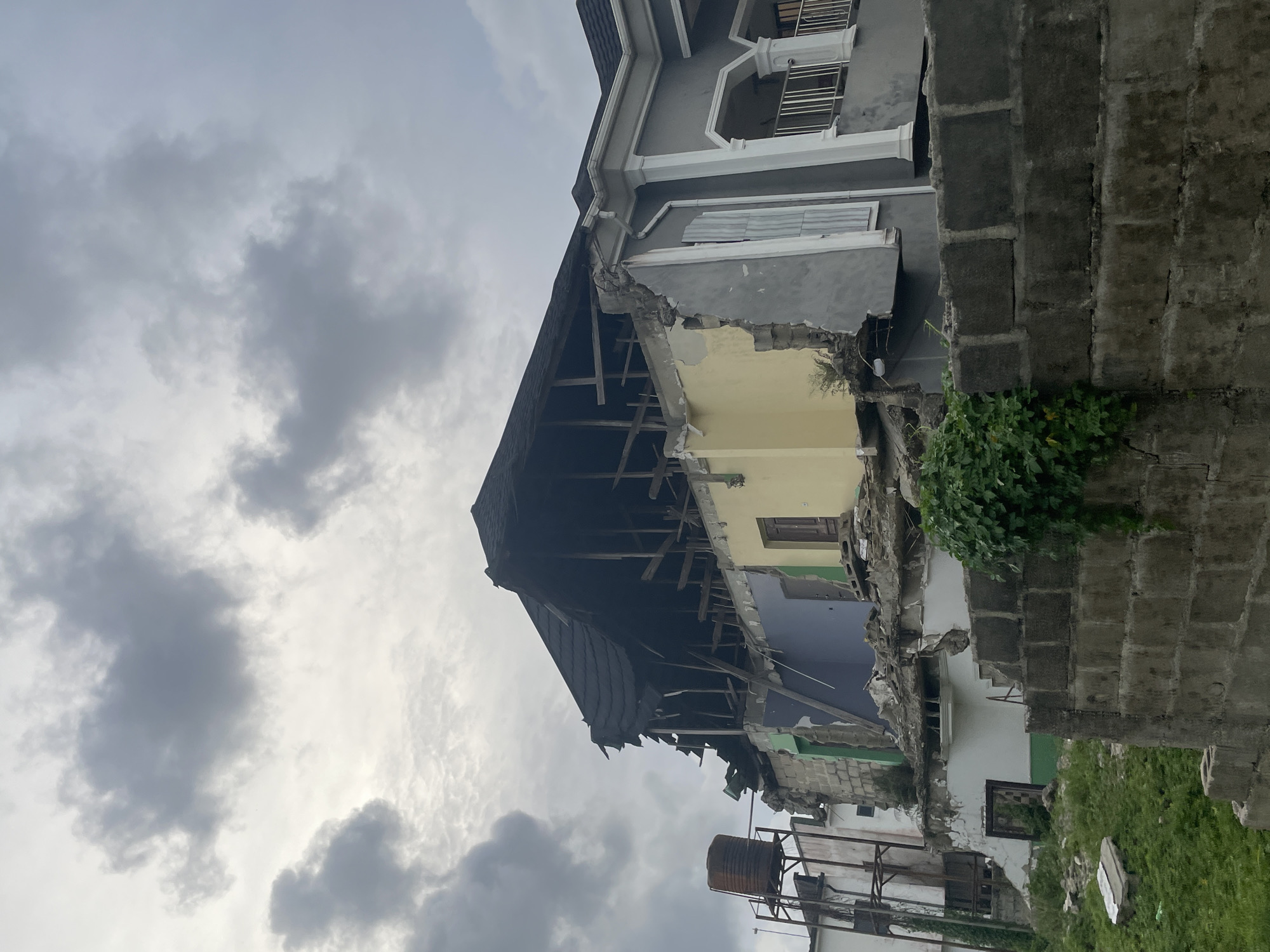 Damaged building observed in Lekki, Nigeria under overcast skies