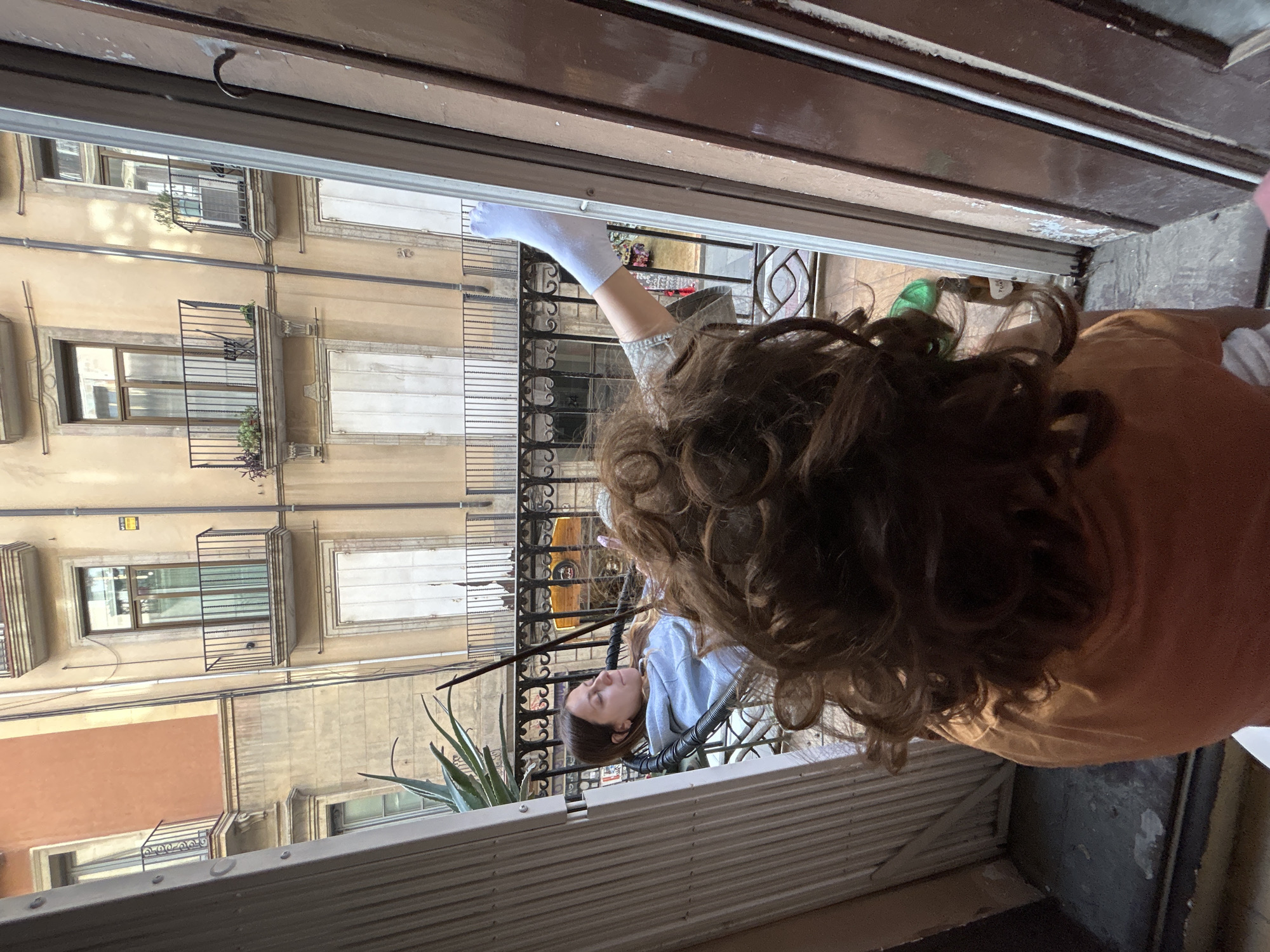 Person spotted on Barcelona balcony during afternoon leisure time