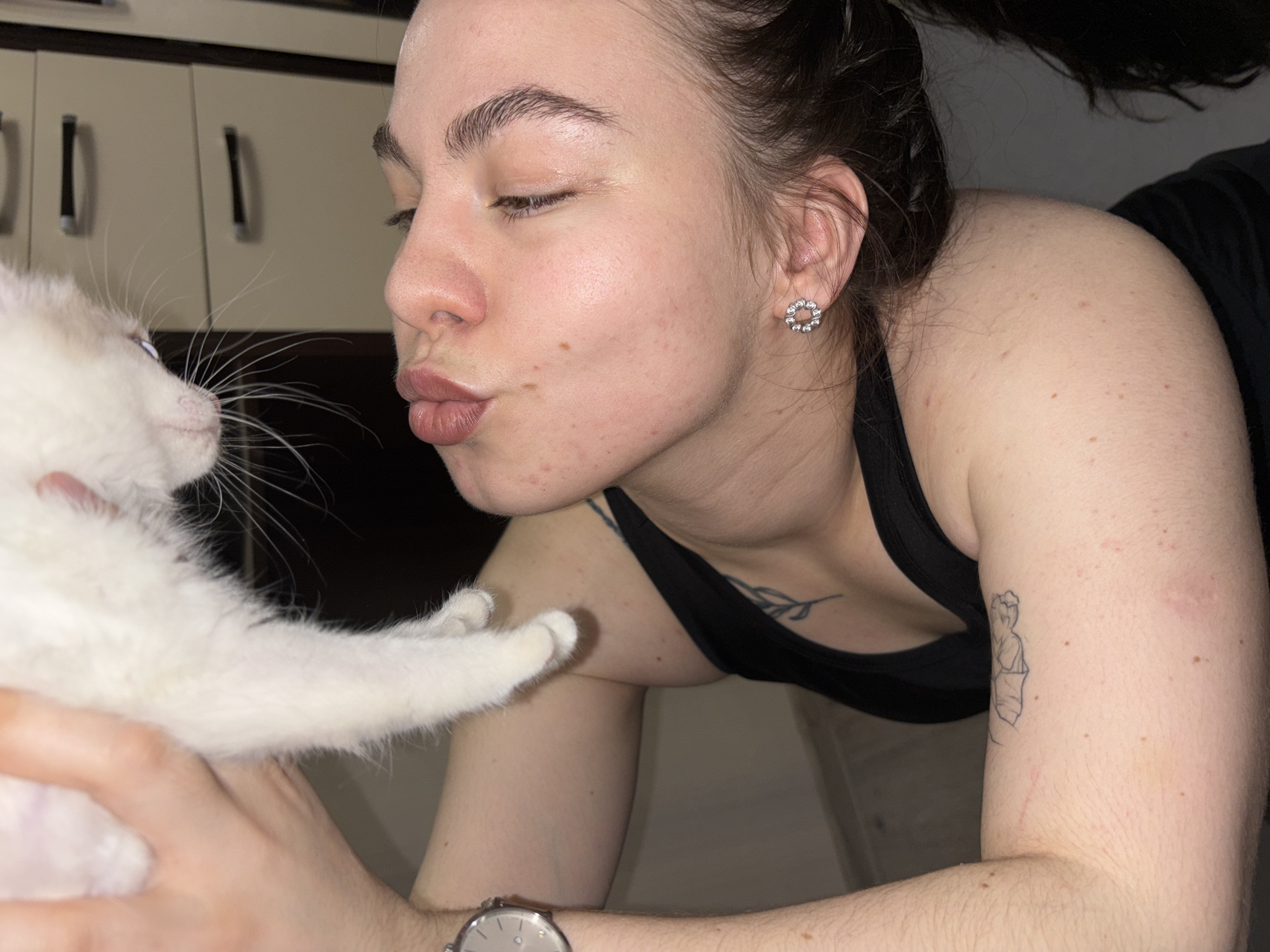 Woman enjoys yoga session with kitten in Perm apartment