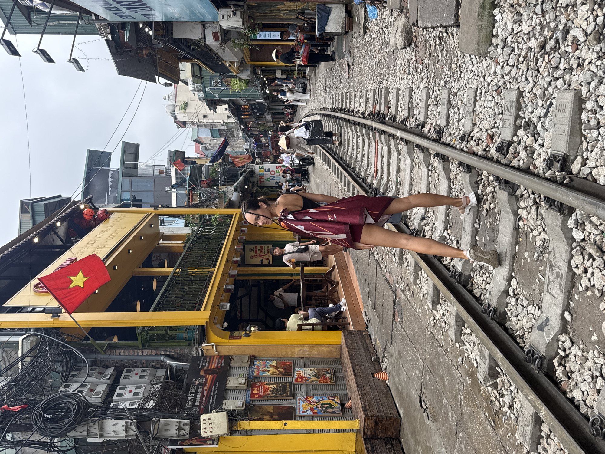 Tourists take selfies on Hanoi's famous Train Street tracks