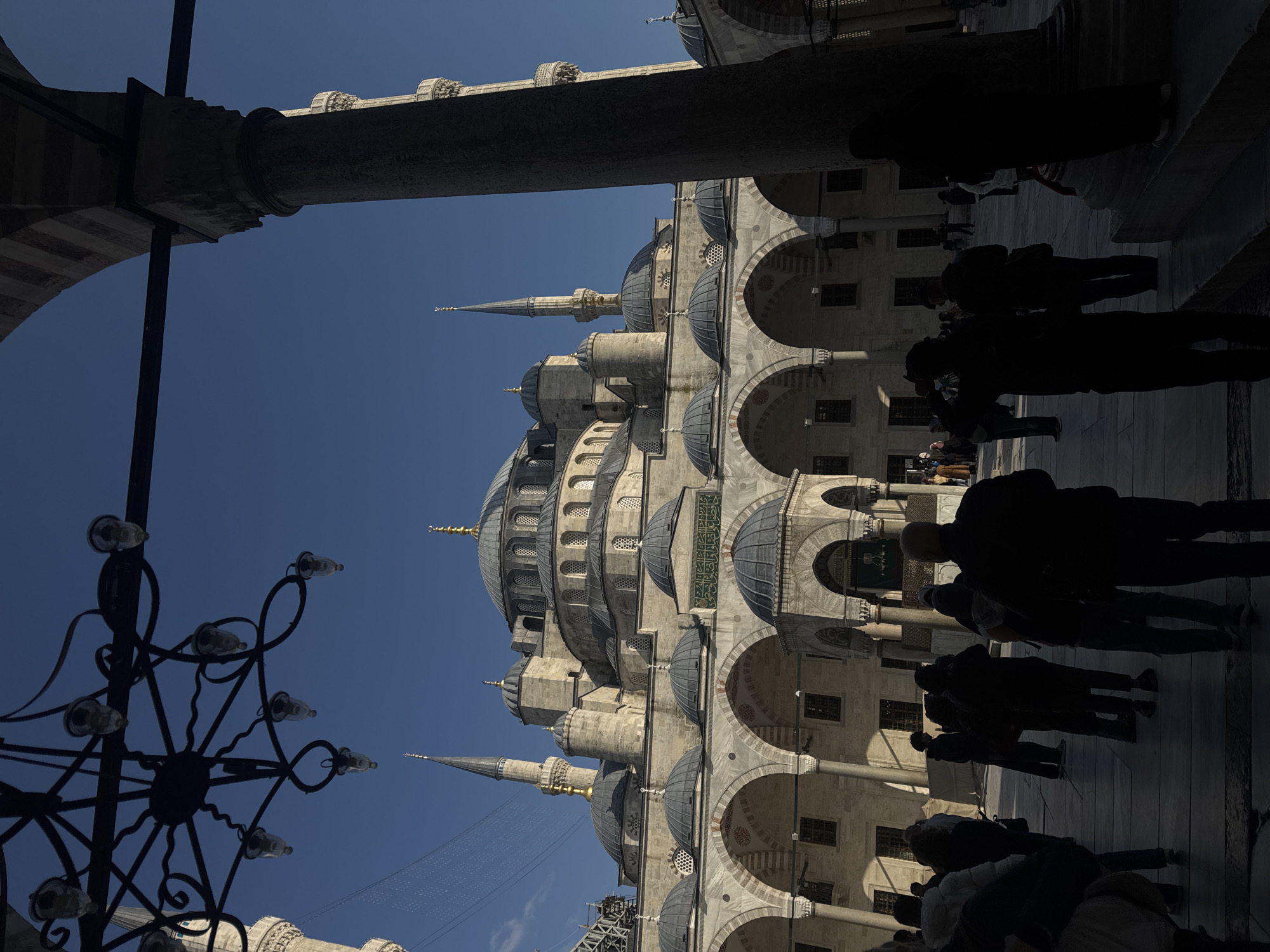 Couple photographs tourist visit at Istanbul's Blue Mosque