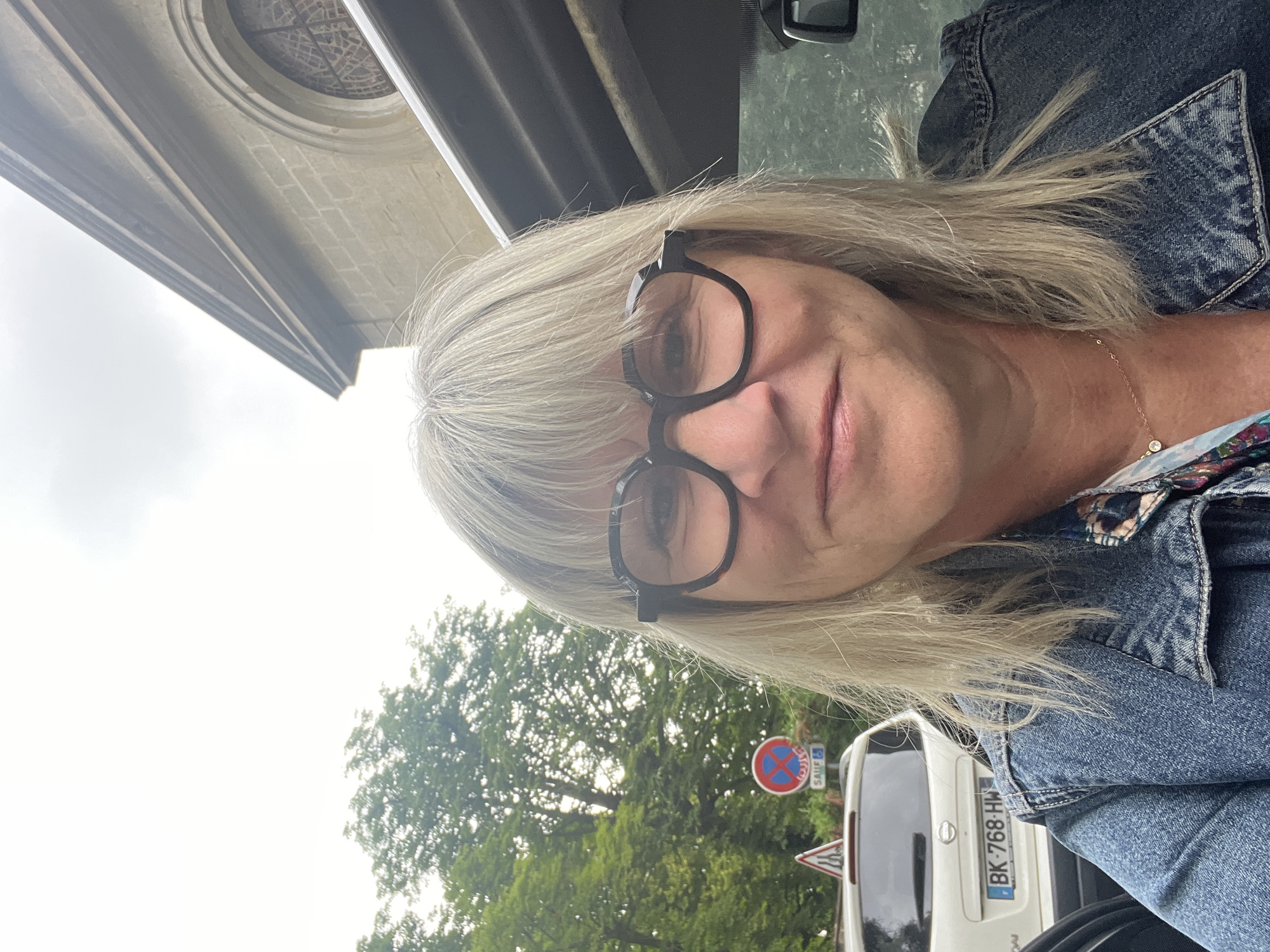 Woman takes multiple selfies around Saint-Étienne in morning
