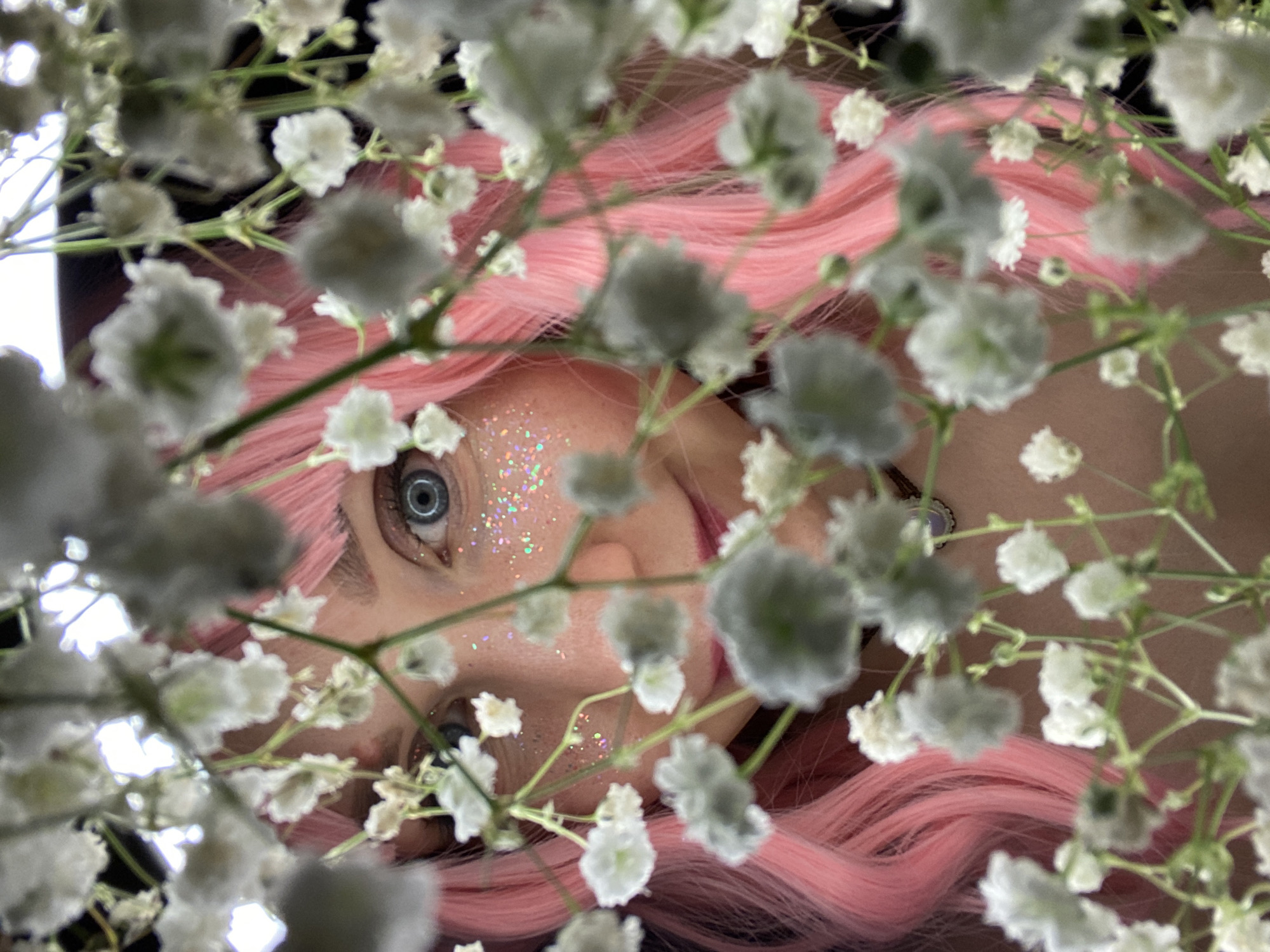 Pink-haired subject poses for artistic portraits in Chaikovsky