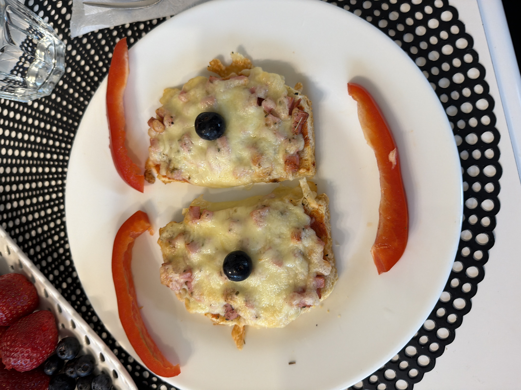 Child enjoys face-shaped breakfast in Baloži, Latvia home