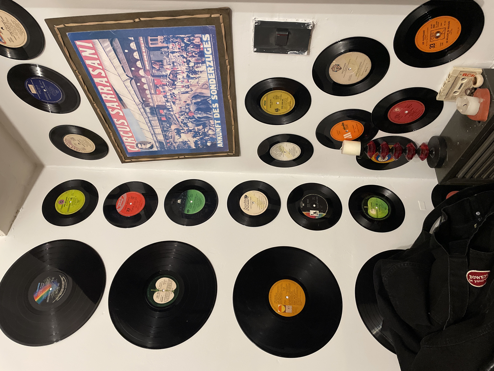 Vintage vinyl record collection displayed on Buenos Aires wall