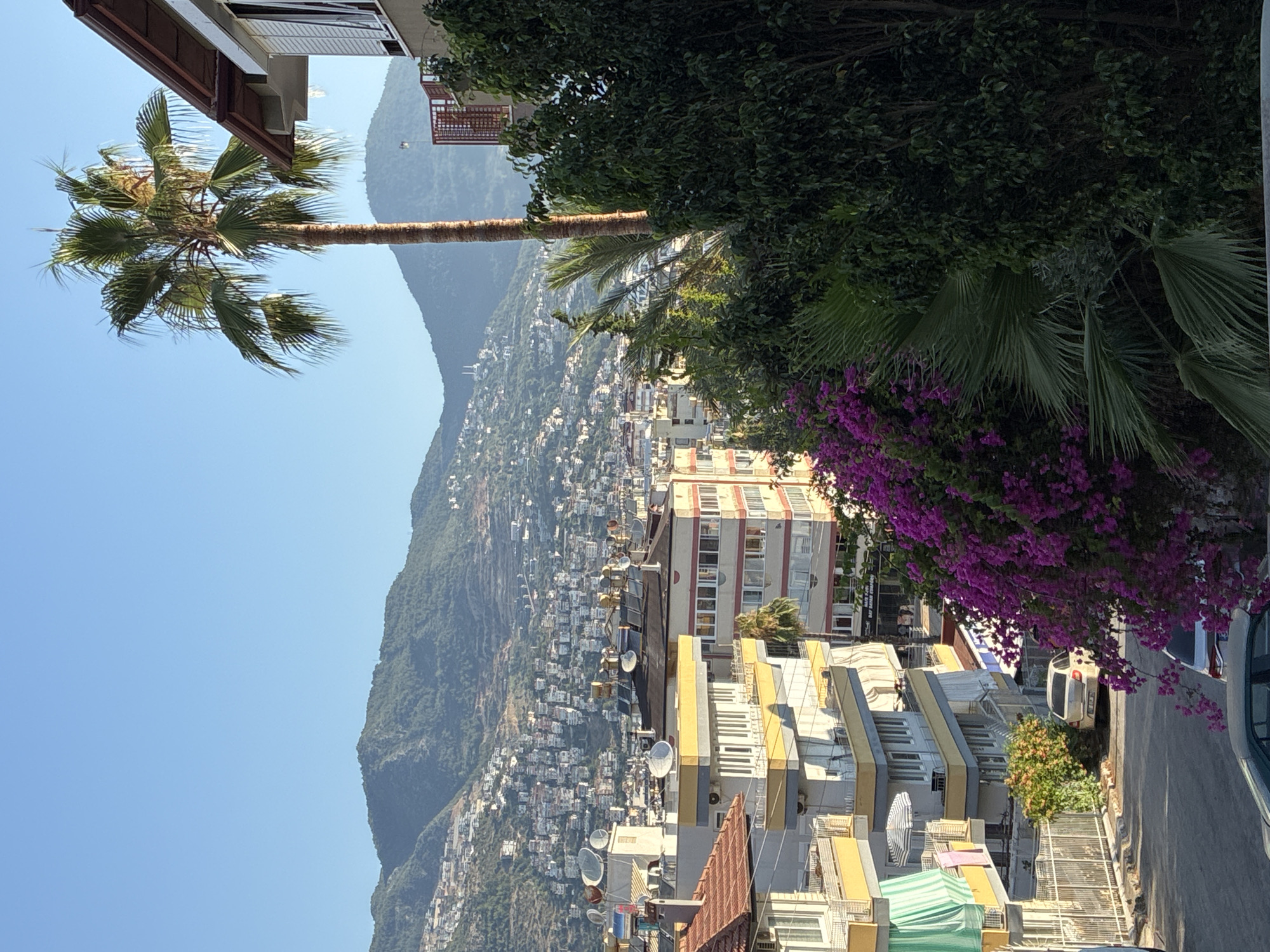 Alanya hillside streets, stairs, and sea views on a sunny morning