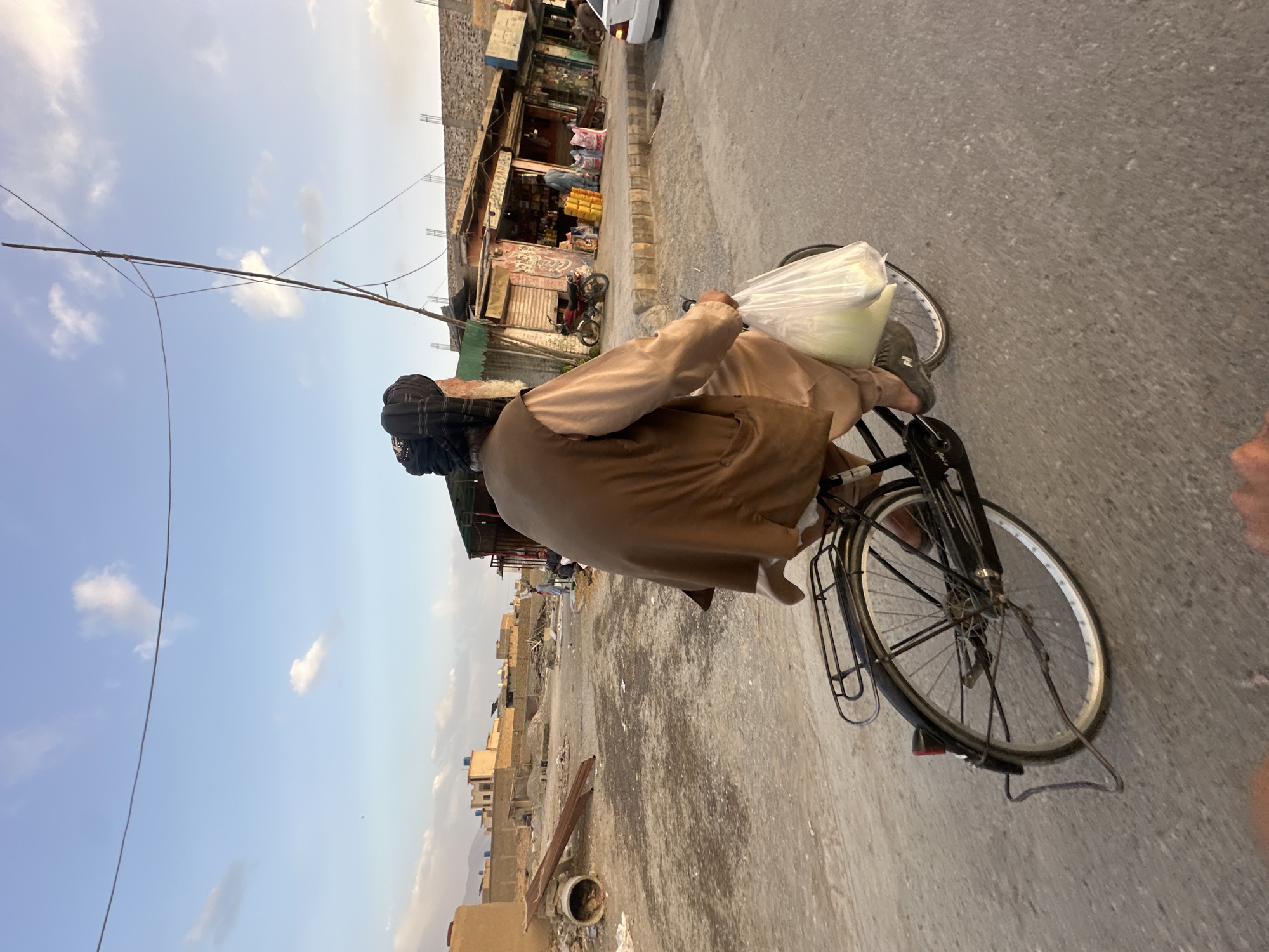 Cyclist spotted carrying bag through Quetta streets