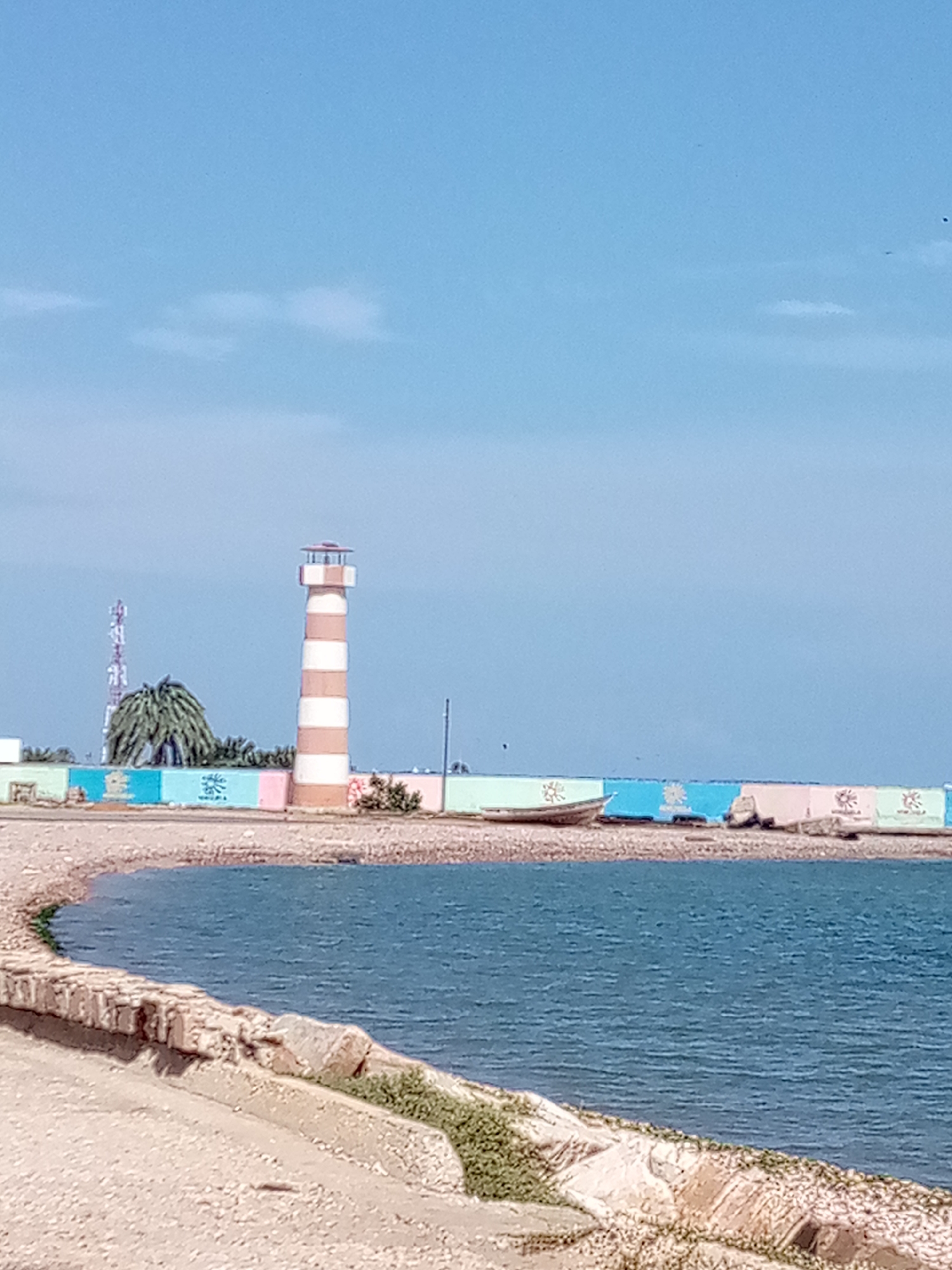 Lighthouse, ferry, and bay views at Punta de Piedras