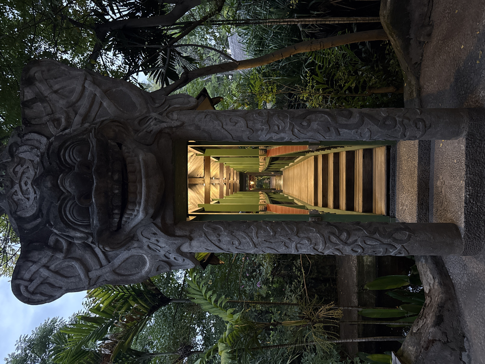Indonesian location documented showing walkway, white building, palm trees