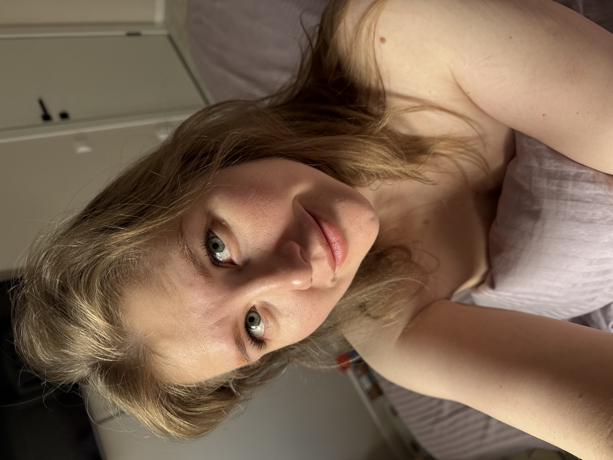 Woman photographed in bed during early morning hours in Russia