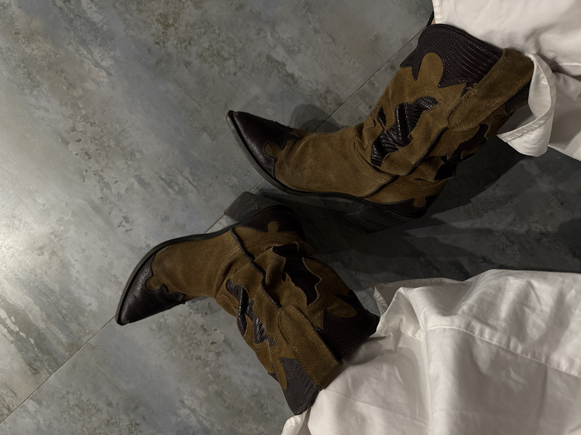 Evening vinyl session with cowboy boots in Yerevan apartment