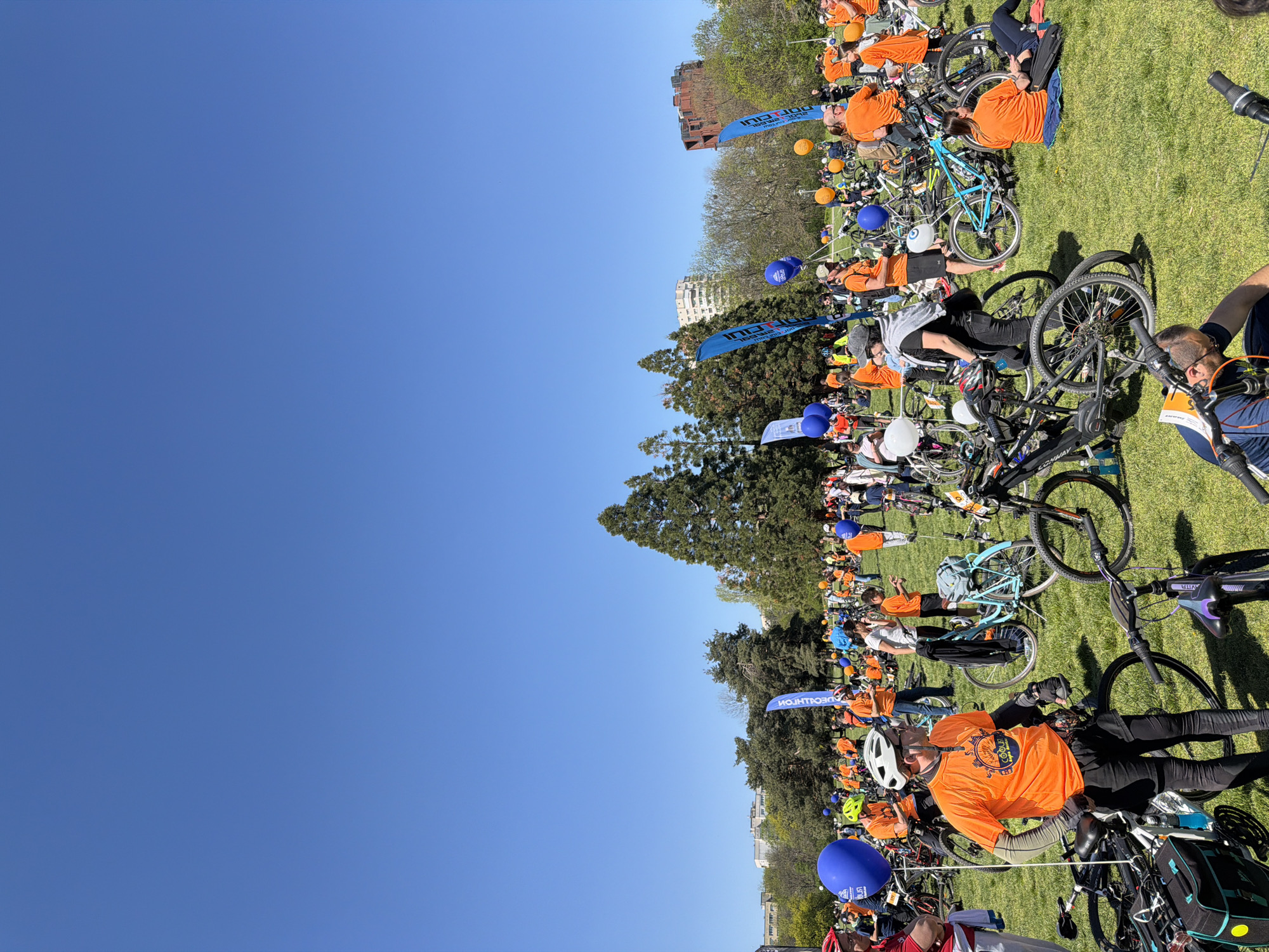 Cyclists in orange gather for event in Sofia park