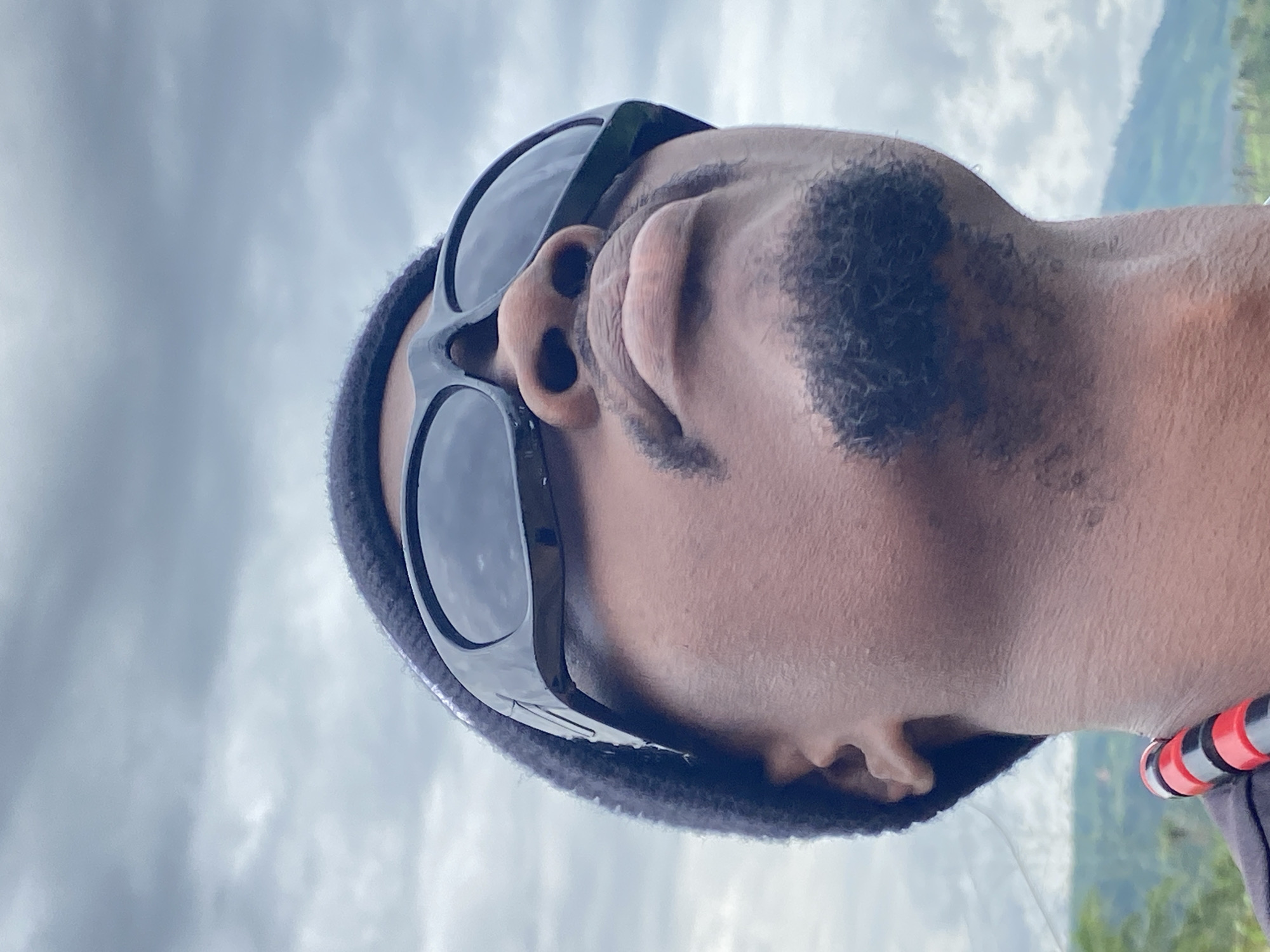 Man gazes at overcast sky in Ufueseni, Nigeria
