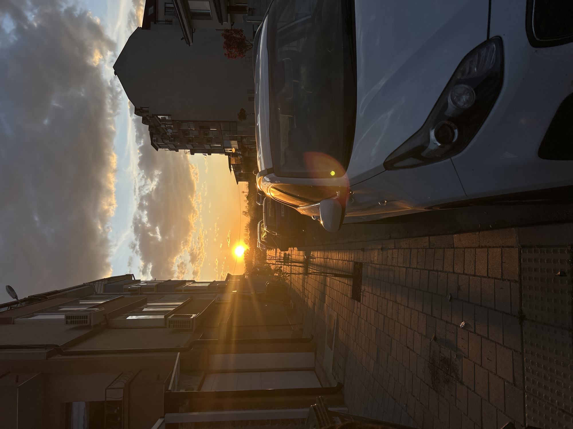 Golden sunset illuminates street scene in Pomorie, Bulgaria