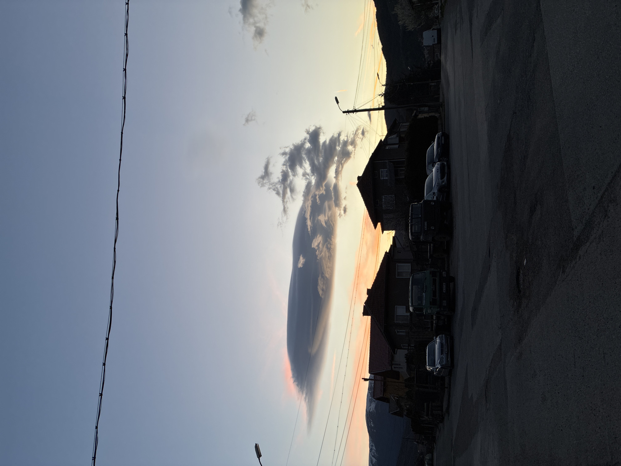 Dramatic lenticular cloud formation captured at sunset in Berkovitsa, Bulgaria